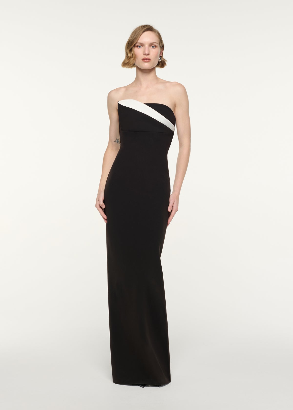 Front view of a model wearing the Strapless Monochrome Drape Gown