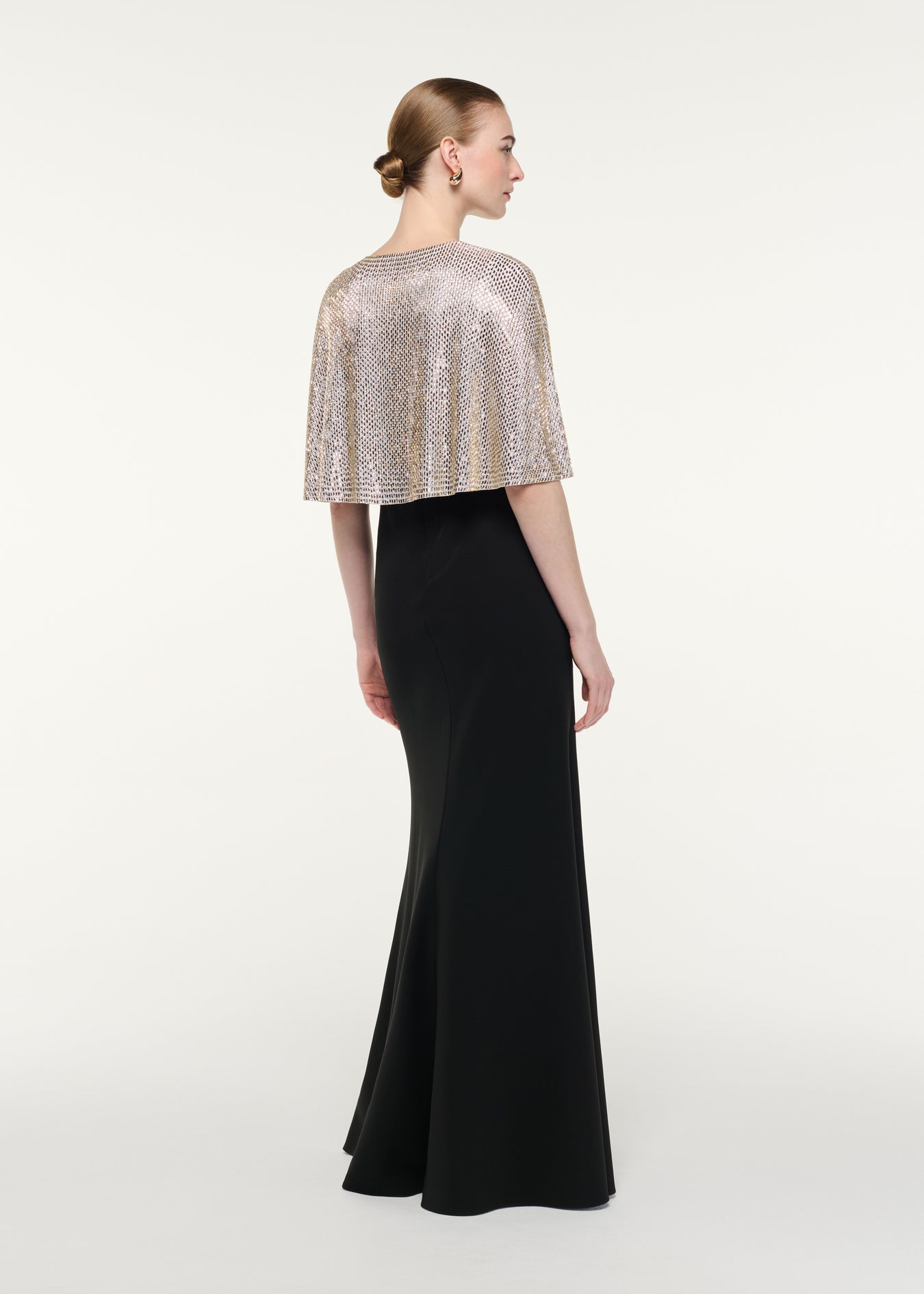 Back view of a model wearing the Contrast Diamante Cape Gown