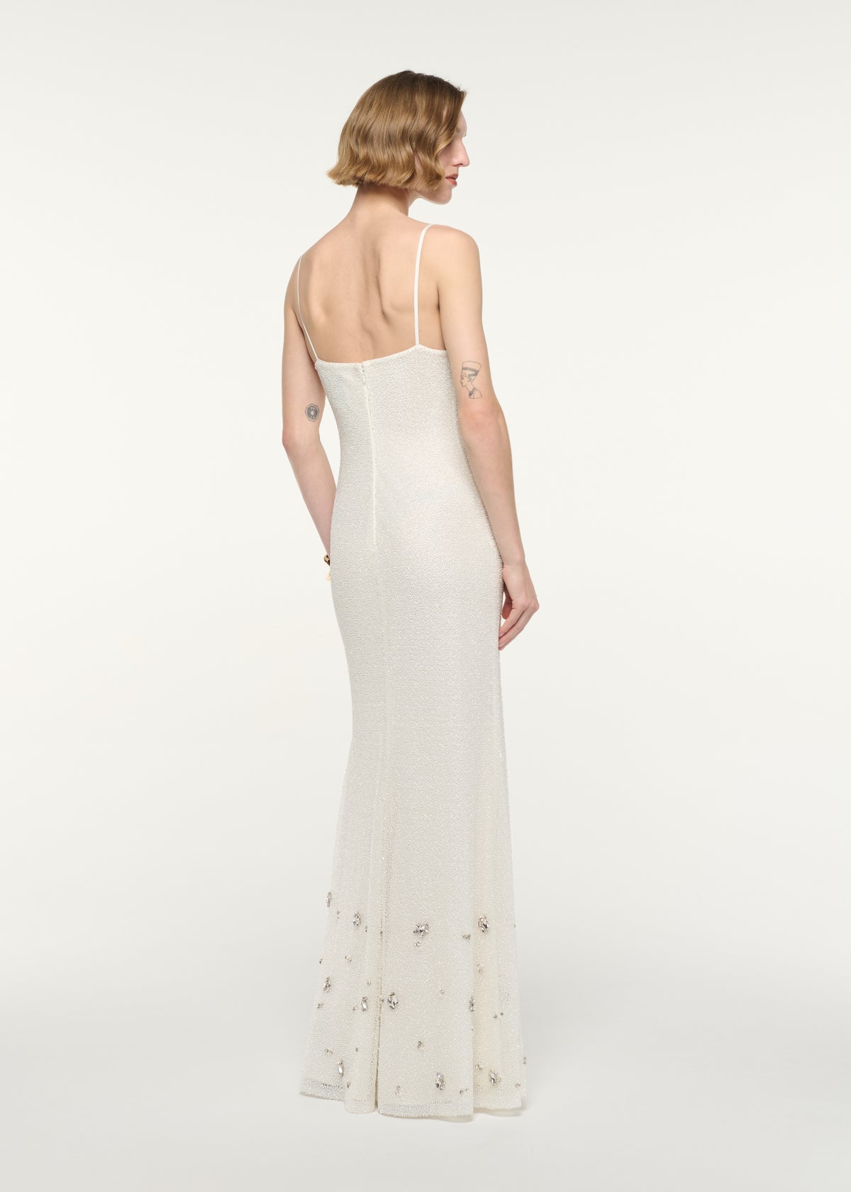 Back view of a model wearing the V-Neck Beaded Slip Dress