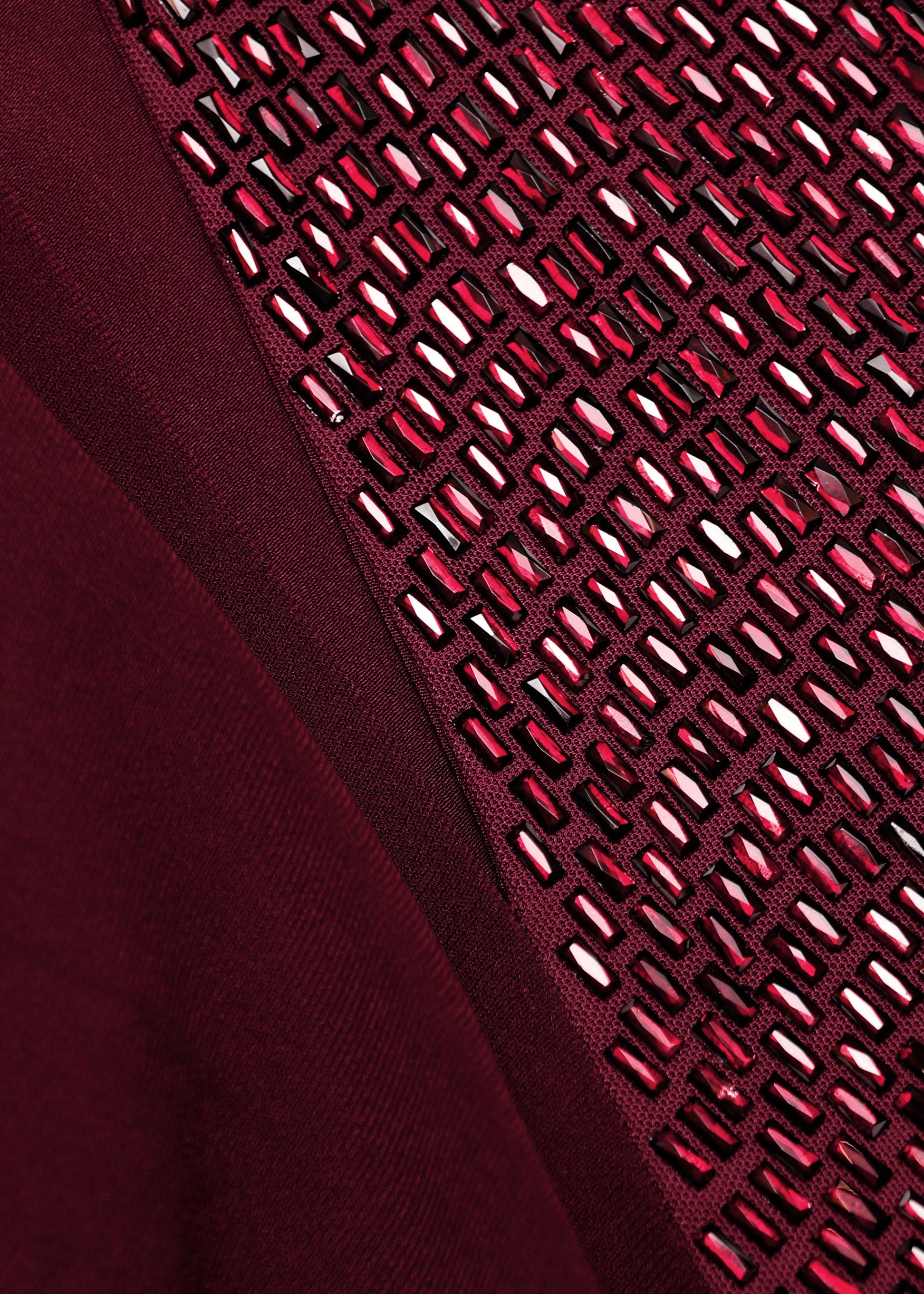 A close up of the fabric for the Diamante Panel One Shoulder Cape Gown