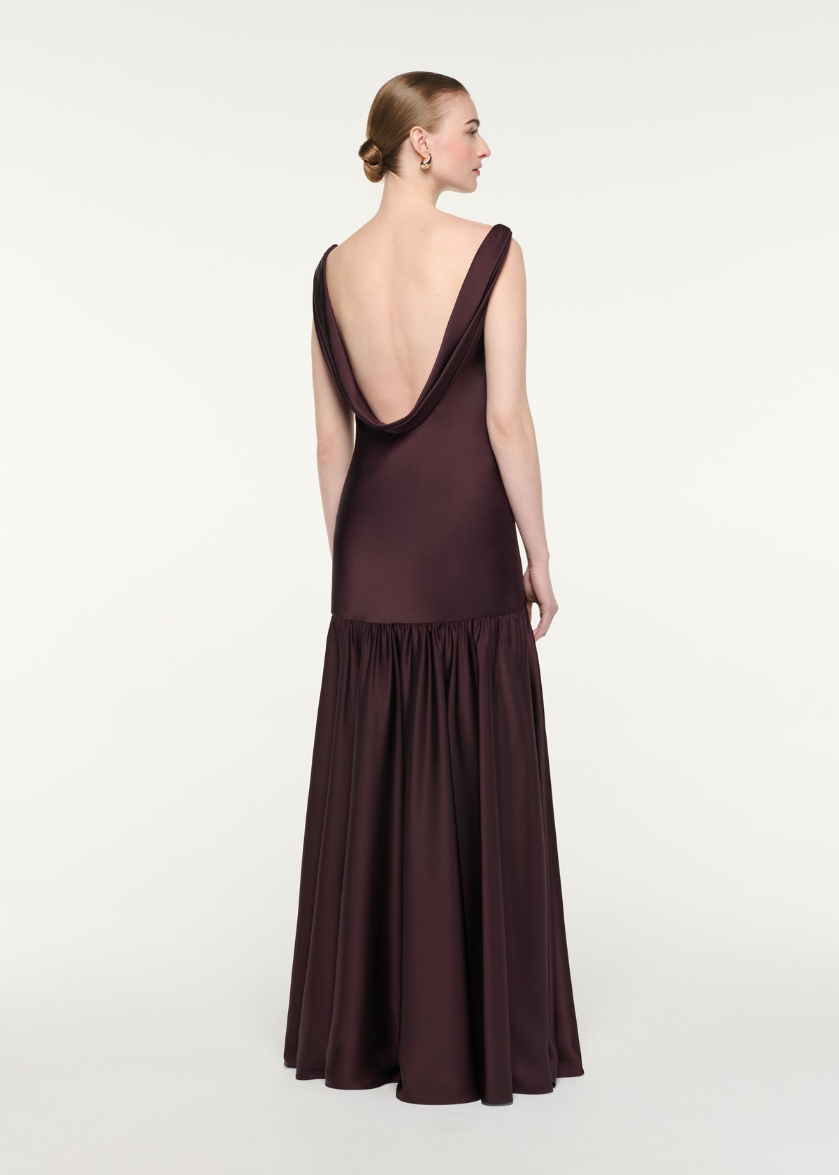 Back view of a model wearing the Twisted Strap Gown
