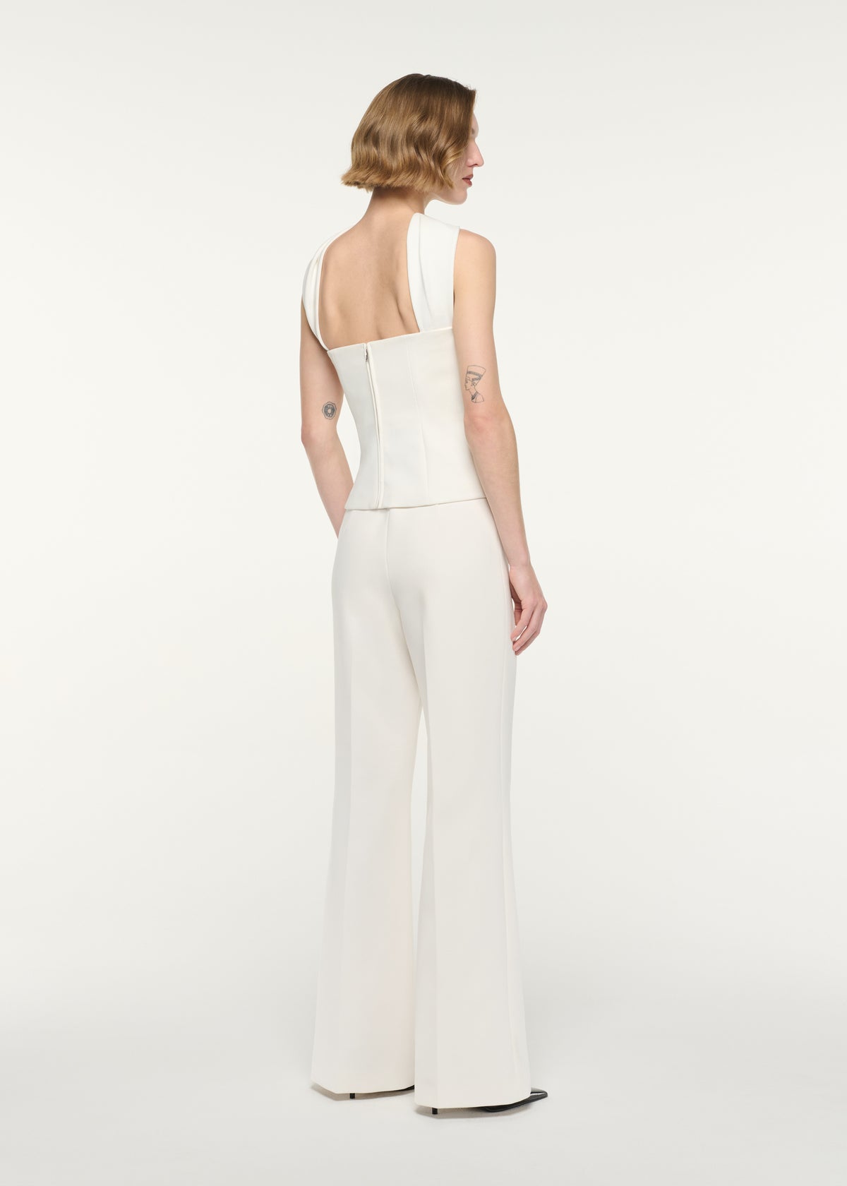 Back view of a model wearing the Scarf Neckline Moon Top