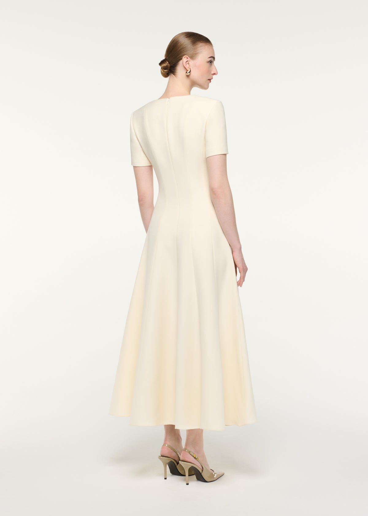 Back view of a model wearing the Scooped Neckline Wool Silk Midi Dress