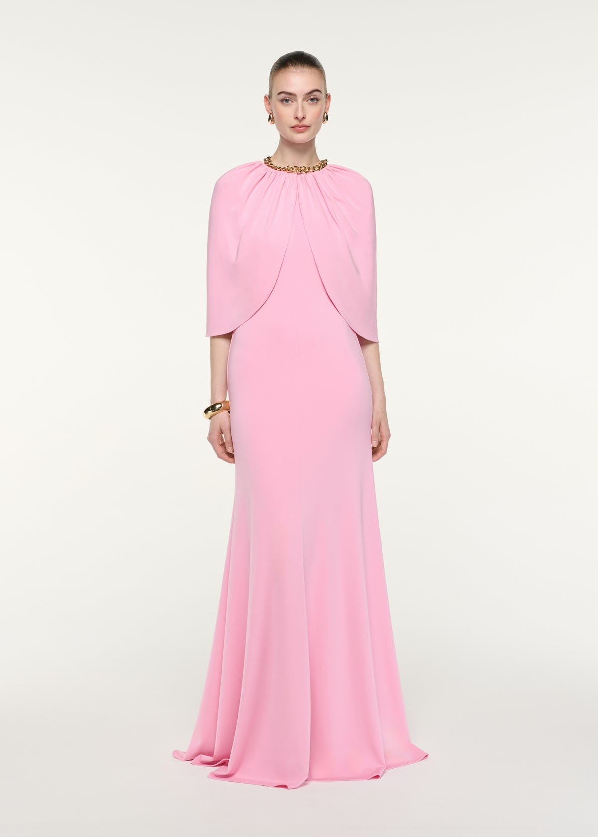 Front view of a model wearing the Gathered Cape Jersey Gown