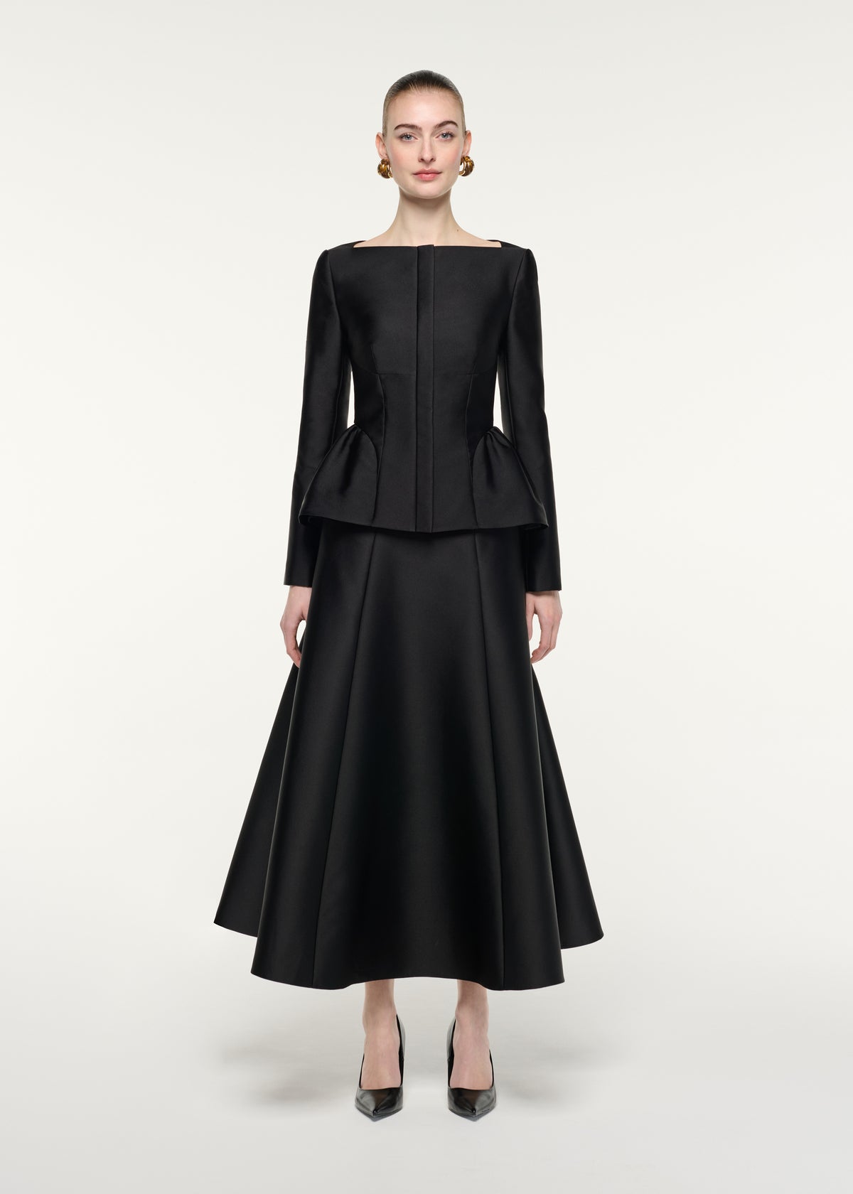 Front view of a model wearing the Full Midi Skirt