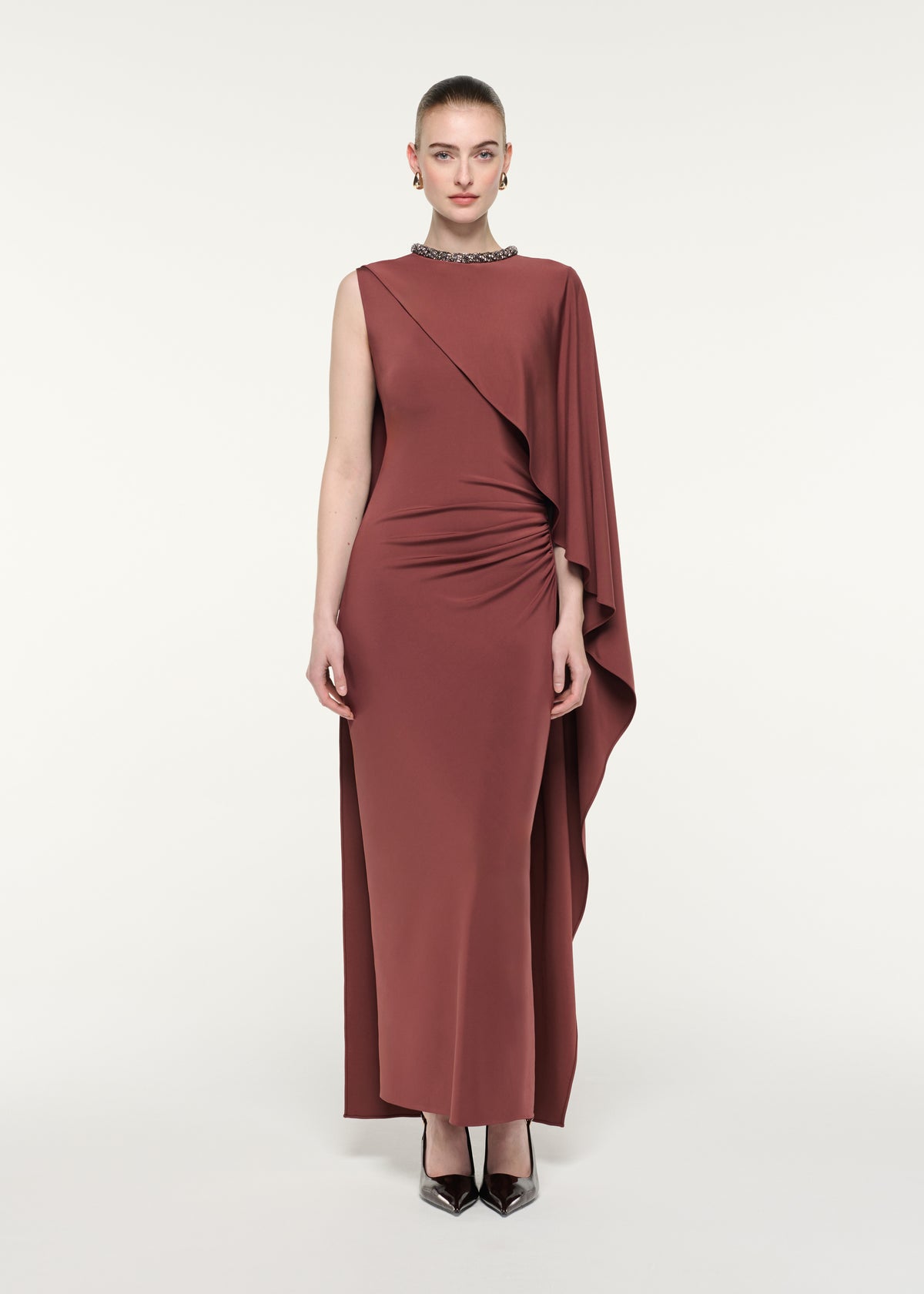 Front view of a model wearing the Crystal Neckline Asymetric Column Maxi Dress