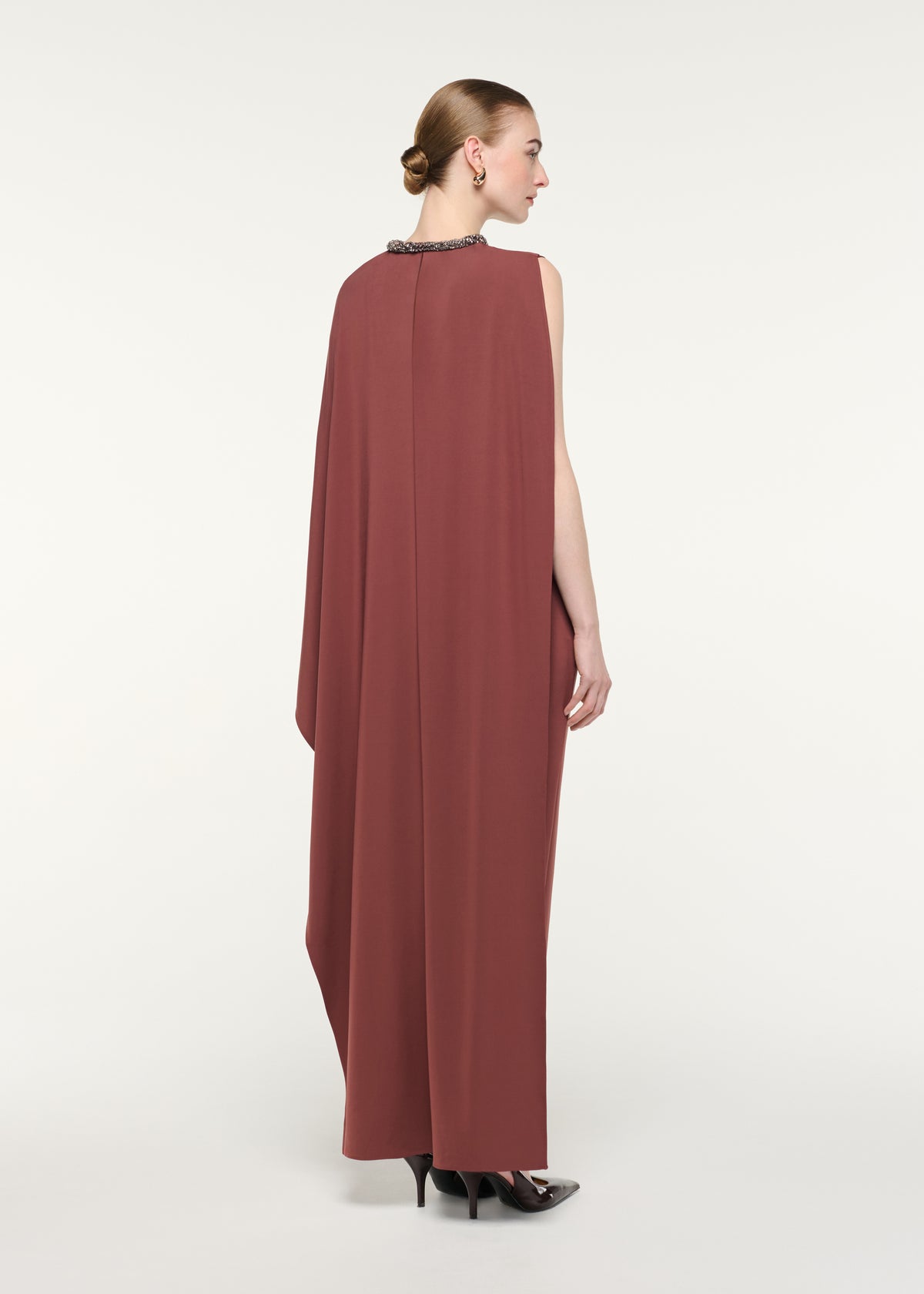 Back view of a model wearing the Crystal Neckline Asymetric Column Maxi Dress