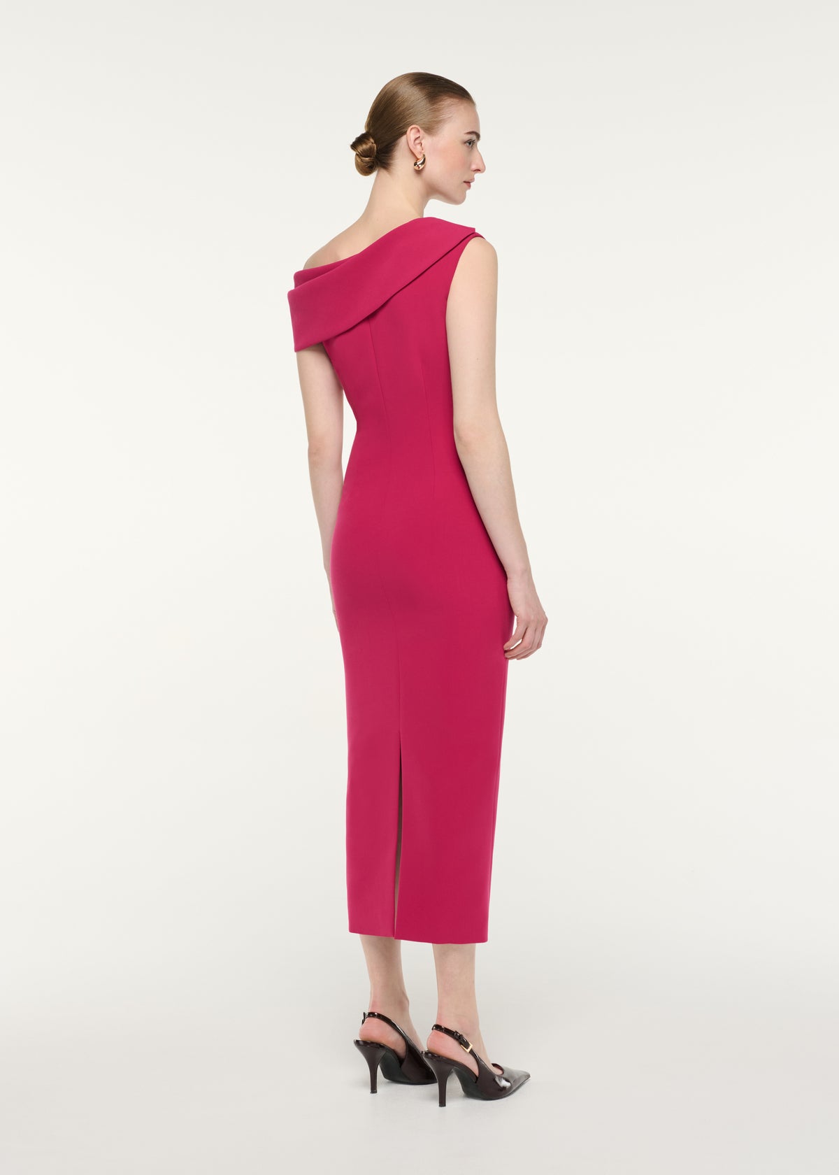 Back view of a model wearing the Asymmetric Drape Midi Dress