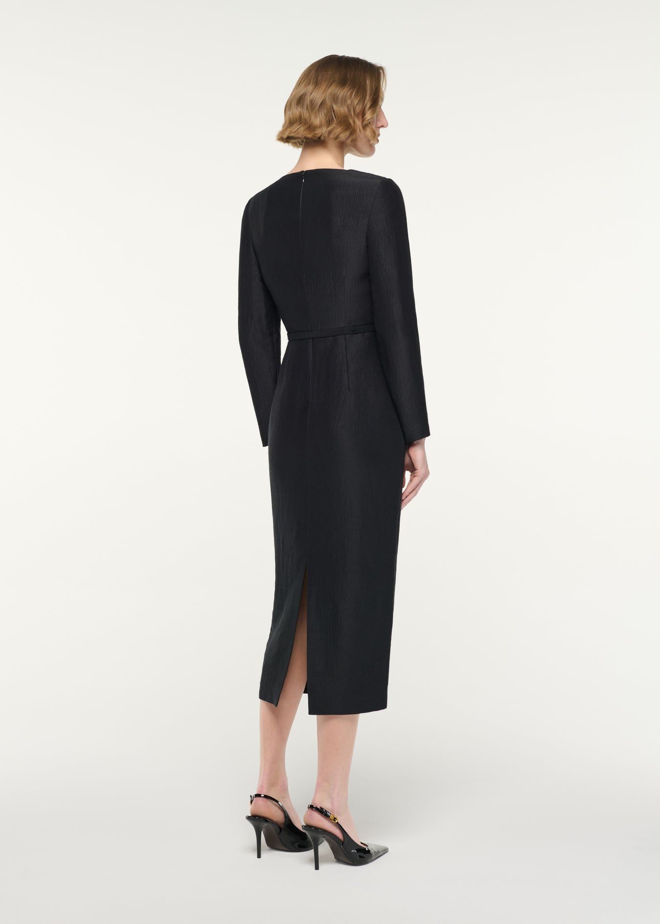 Back view of a model wearing the Brooched Silk Jacquard Midi Dress