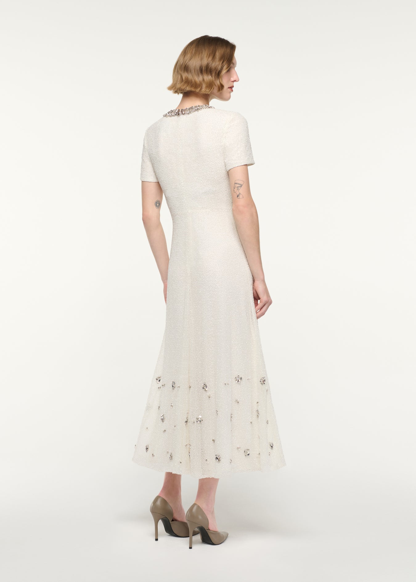 Back view of a model wearing the Crystal Beaded Midi Dress