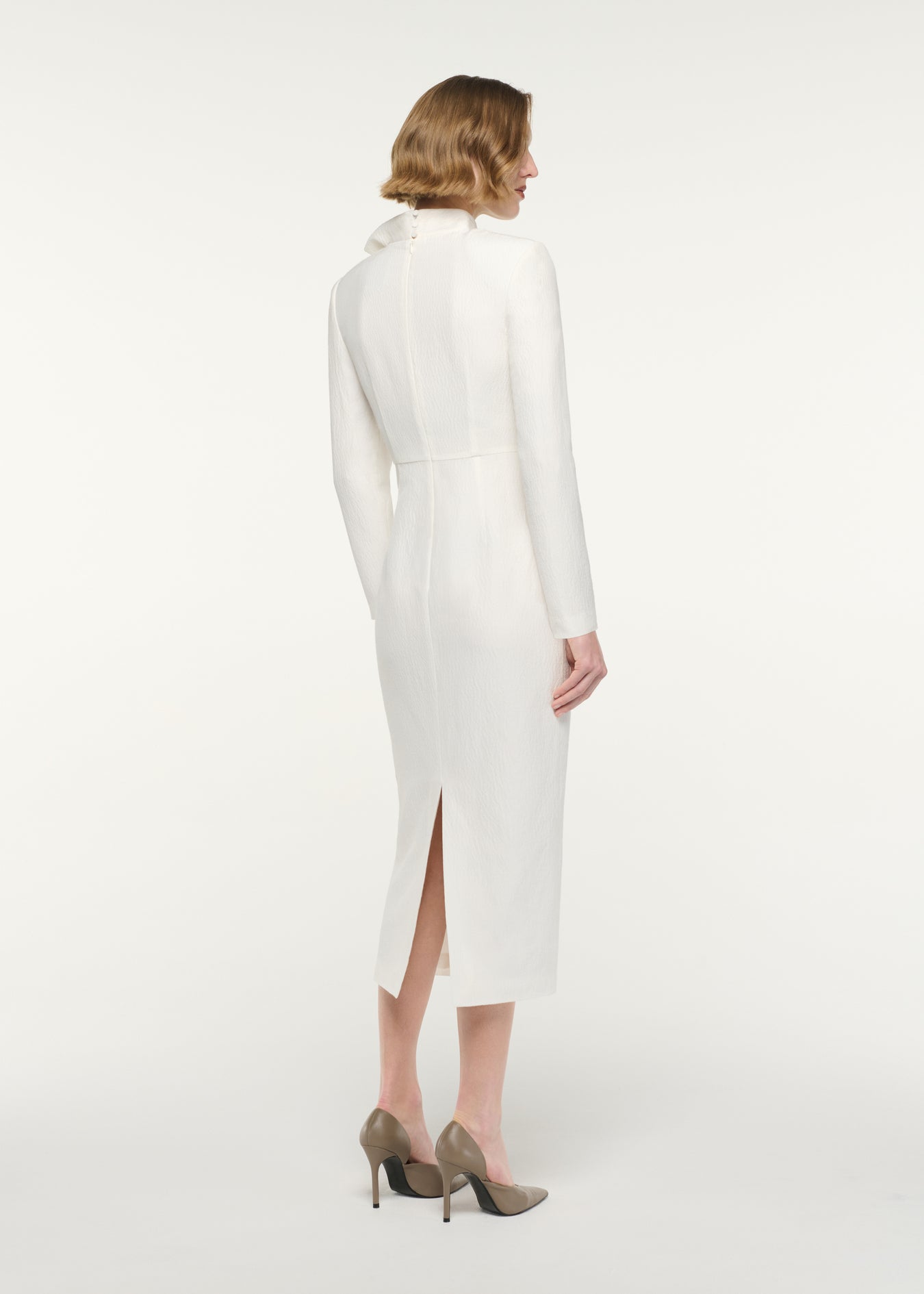 Back view of a model wearing the Bow Neckline Long Sleeve Midi Dress
