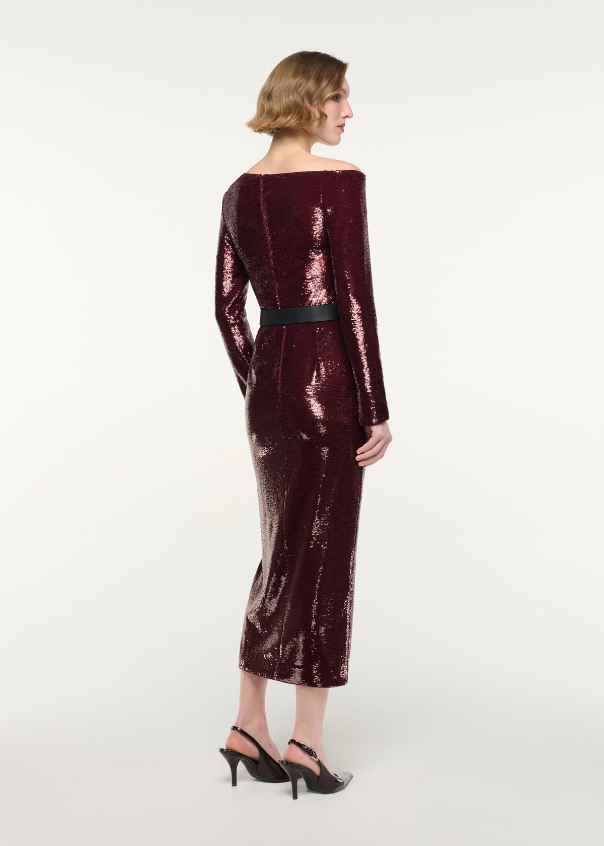 Back view of a model wearing the Sequin Column Skirt