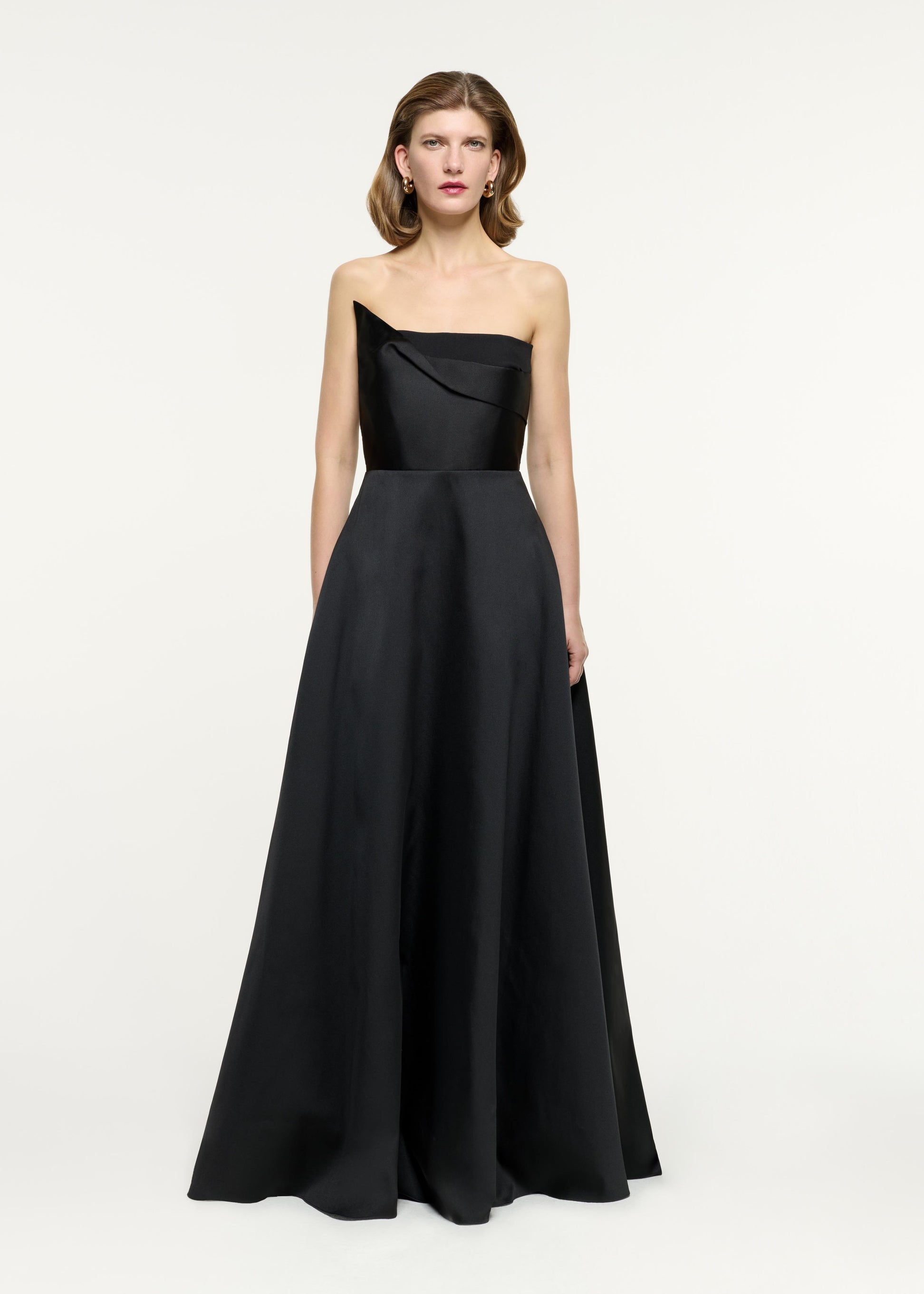 Front view of a model wearing the Strapless Taffeta Gown in Black