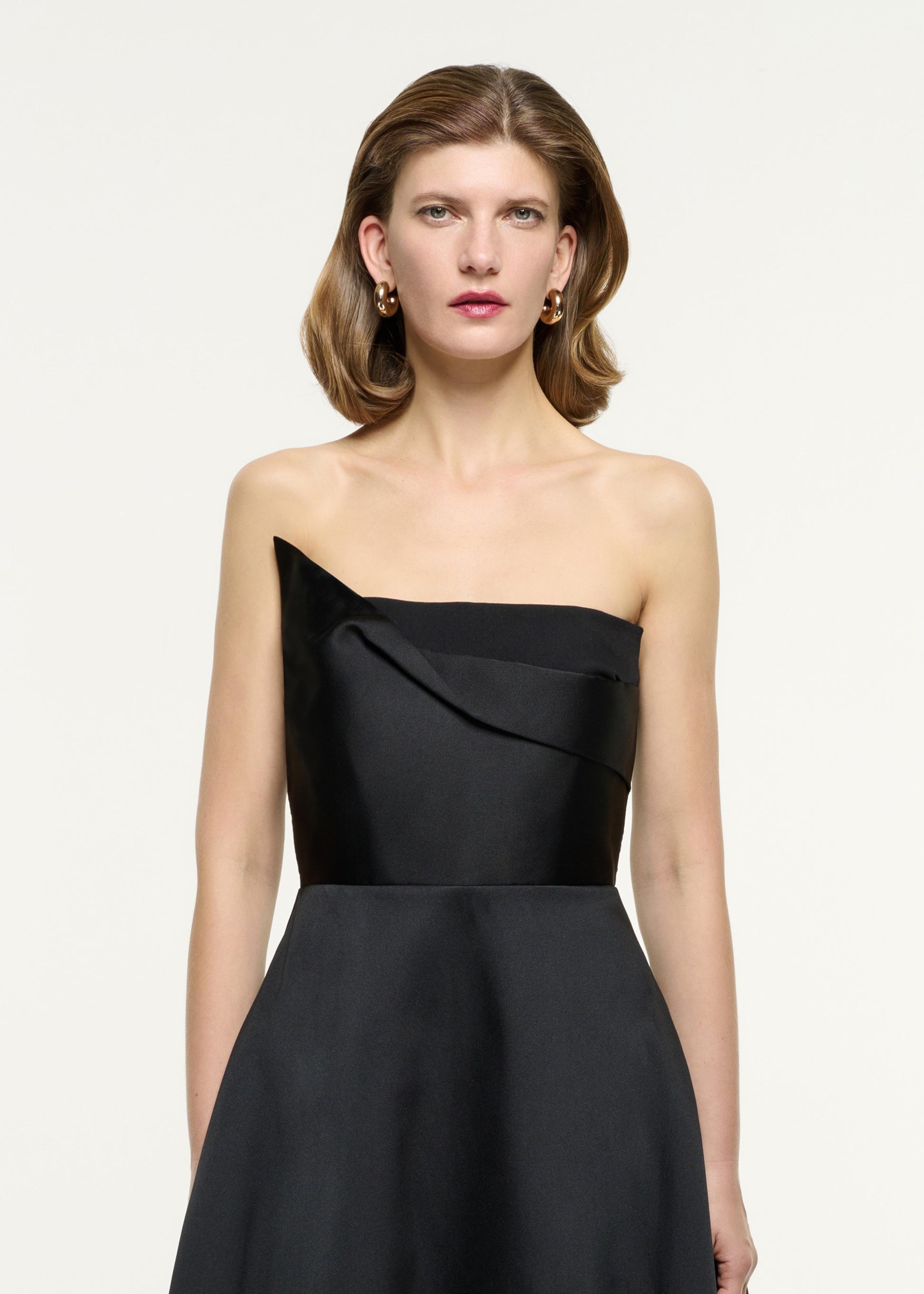 Close up of a model wearing the Strapless Taffeta Gown in Black