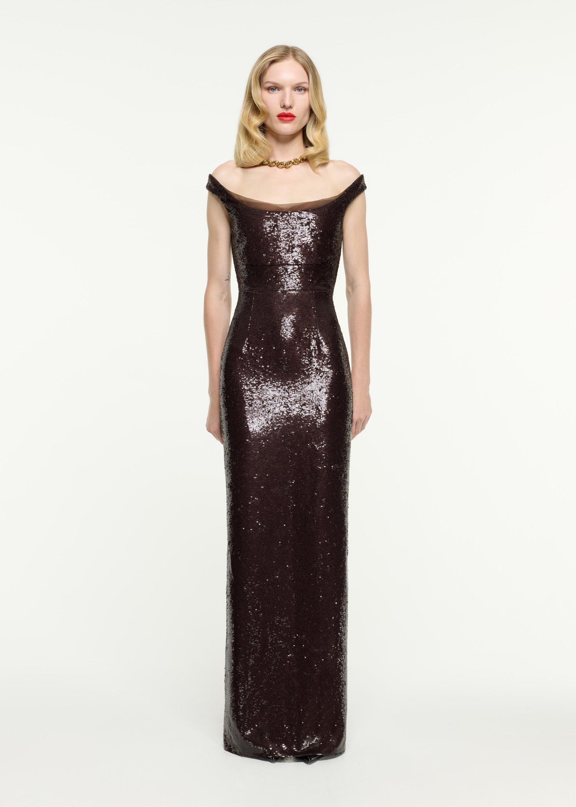 Front view of a model wearing the Off The Shoulder Sequin Gown in Brown