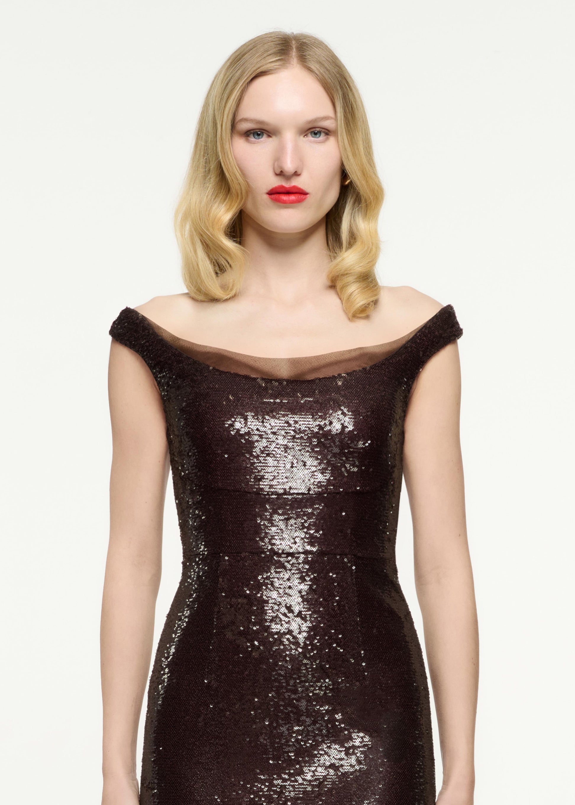 Close up of a model wearing the Off The Shoulder Sequin Midi Dress in Brown