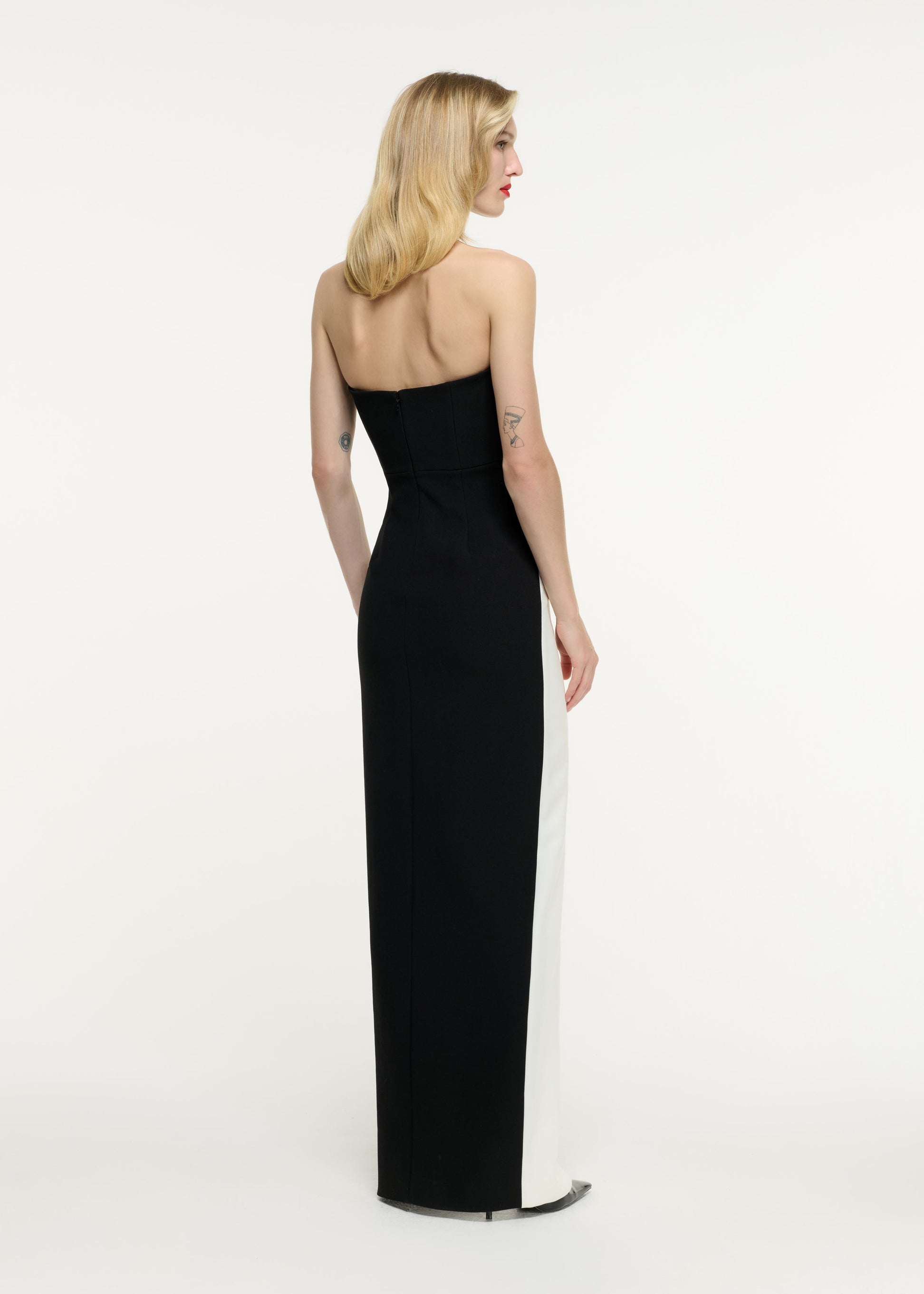 Back view of a model wearing the Strapless Crepe Gown in Monochrome