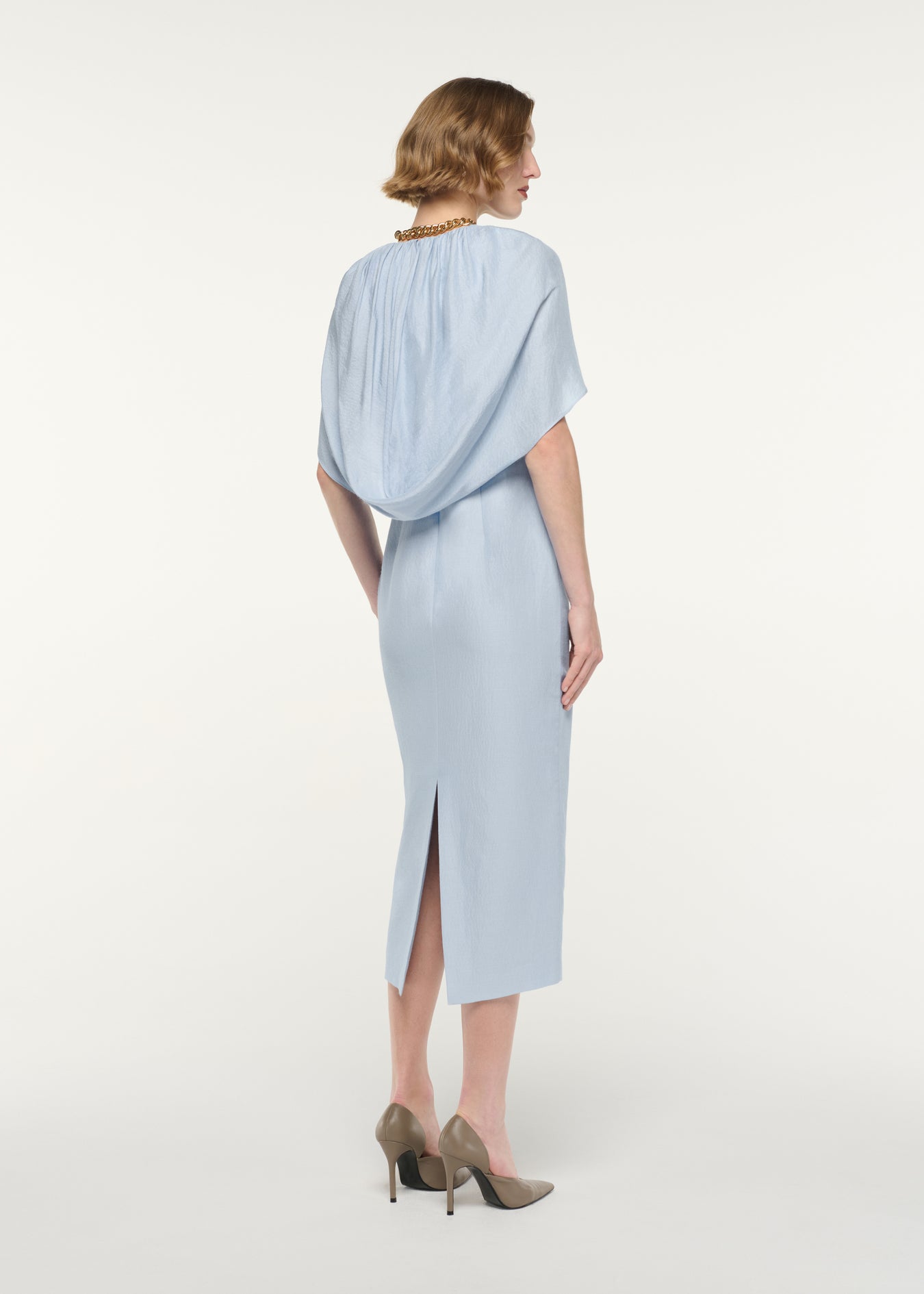 Back view of a model wearing the Gathered Cape Column Fit Midi Dress
