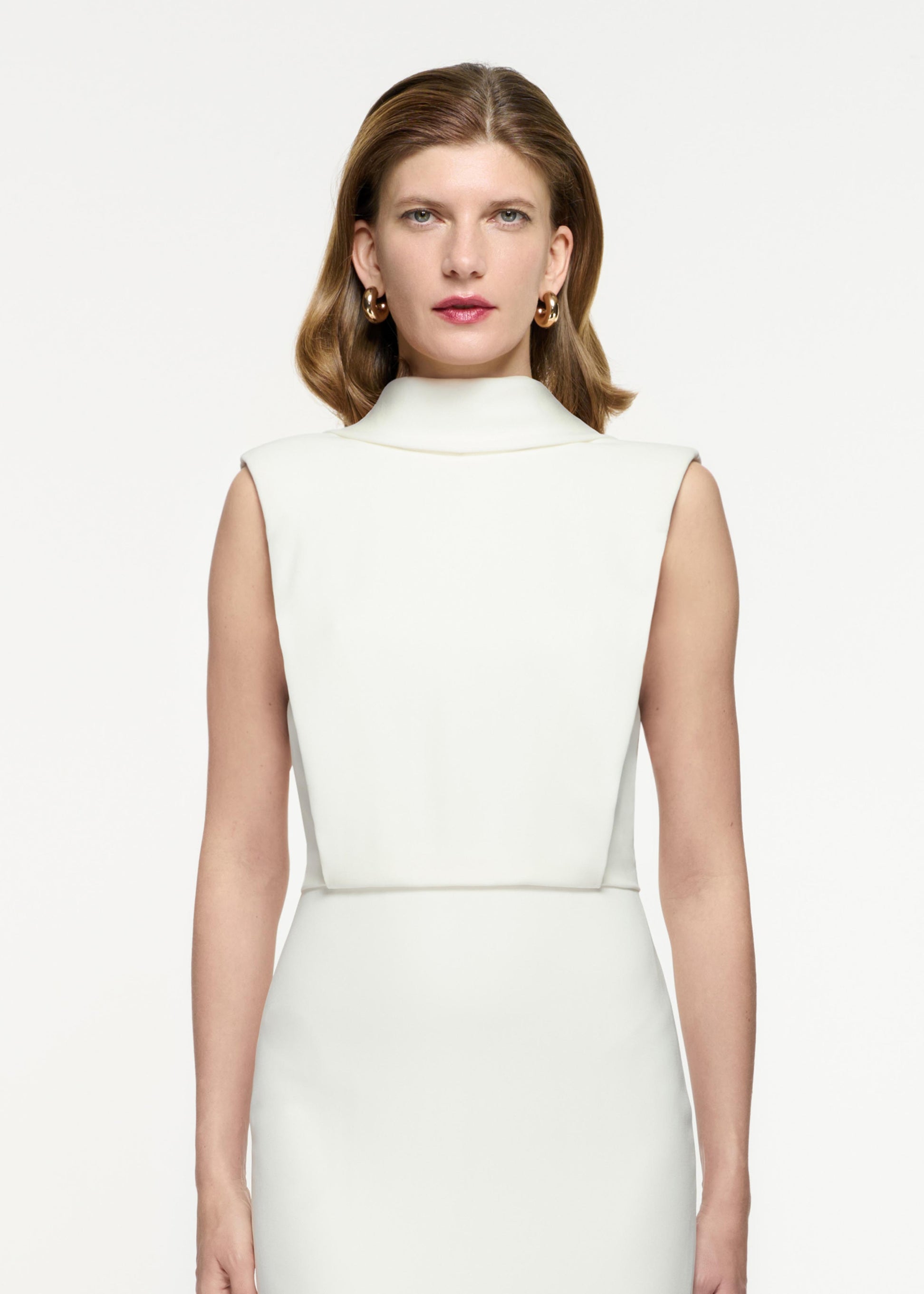 Close up of a model wearing the Stretch Cady Midi Dress in White