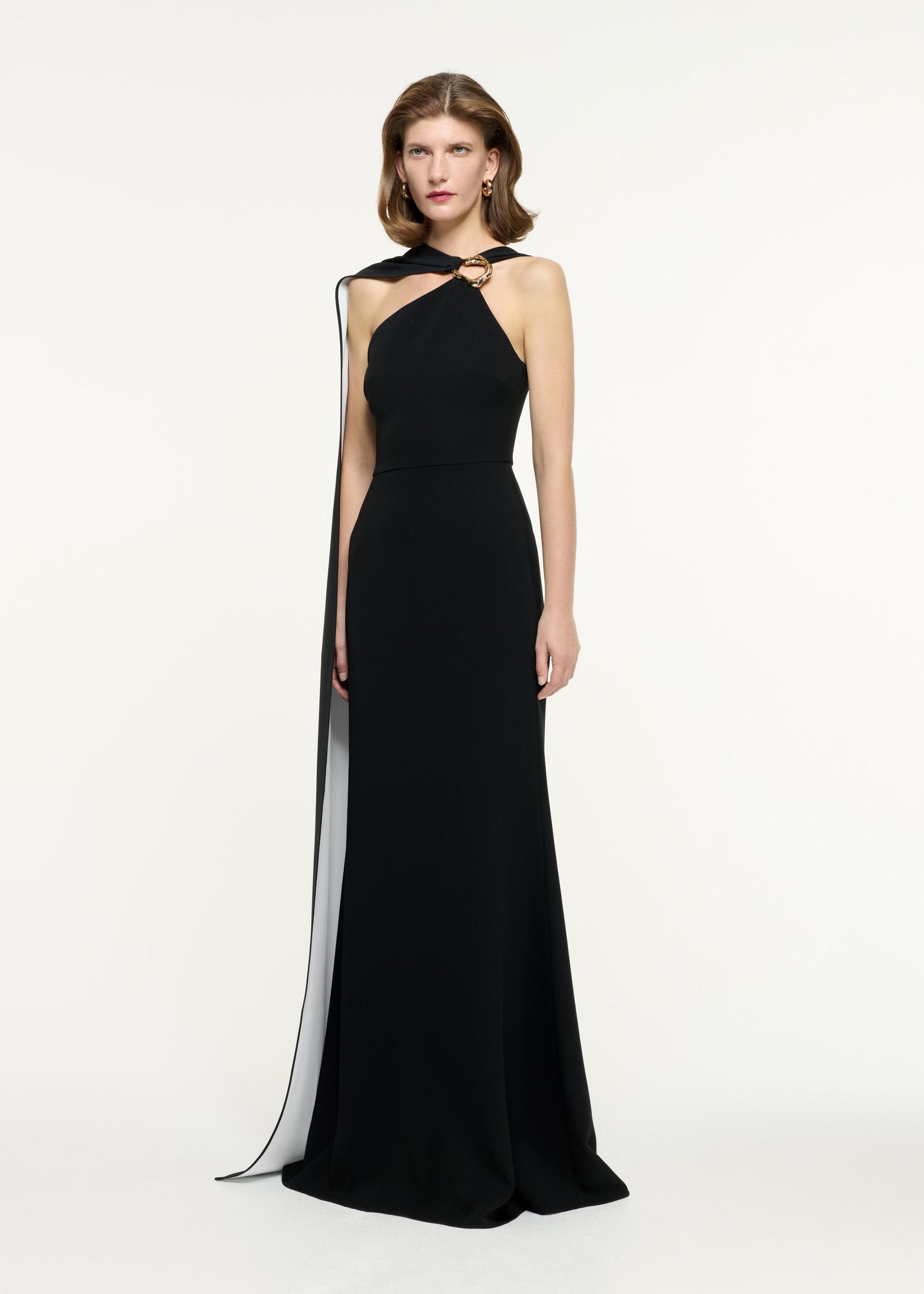 Side view of a model wearing the Asymmetric Buckle Gown in Monochrome