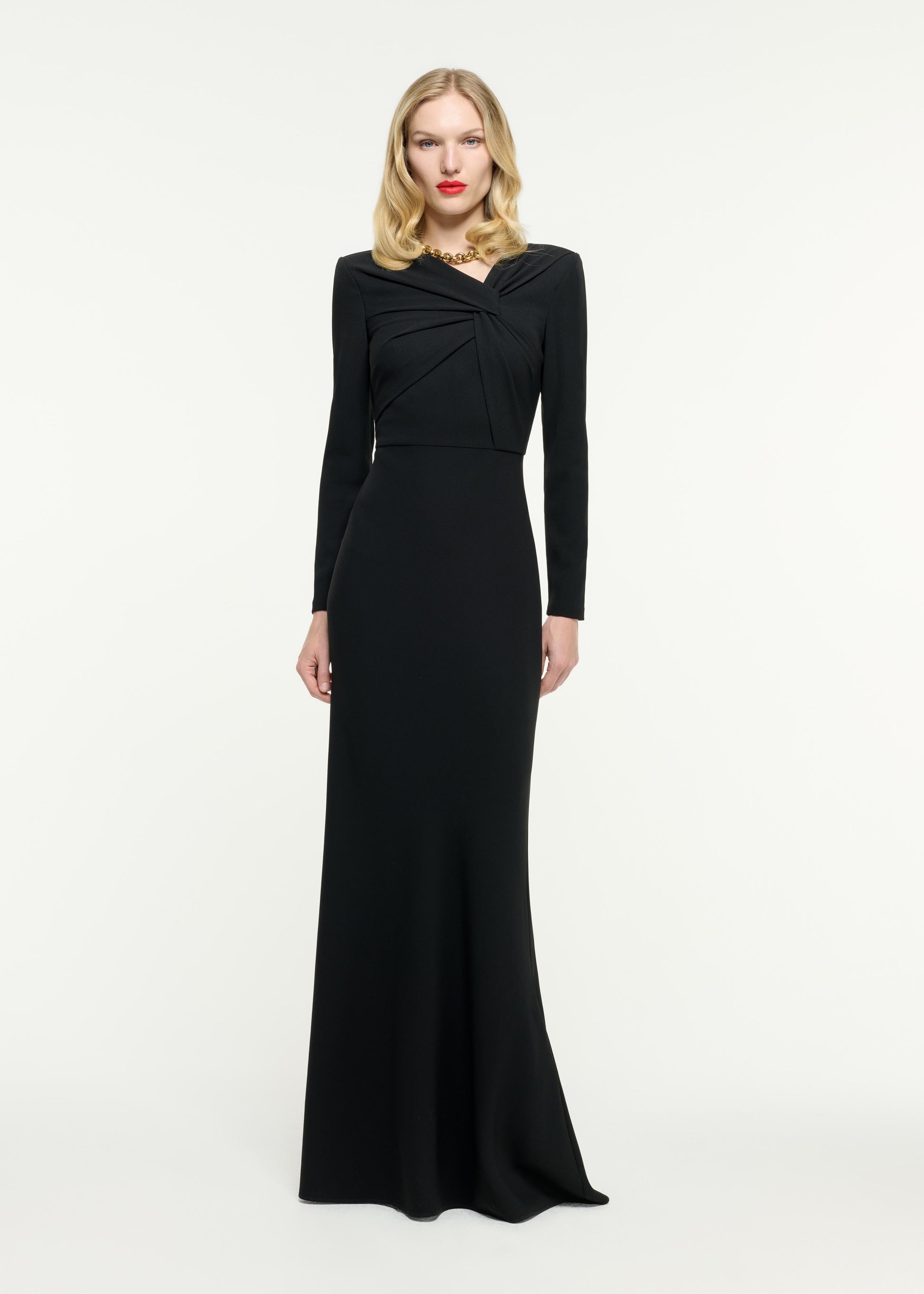 Front view of a model wearing the Long Sleeve Light Cady Gown in Black
