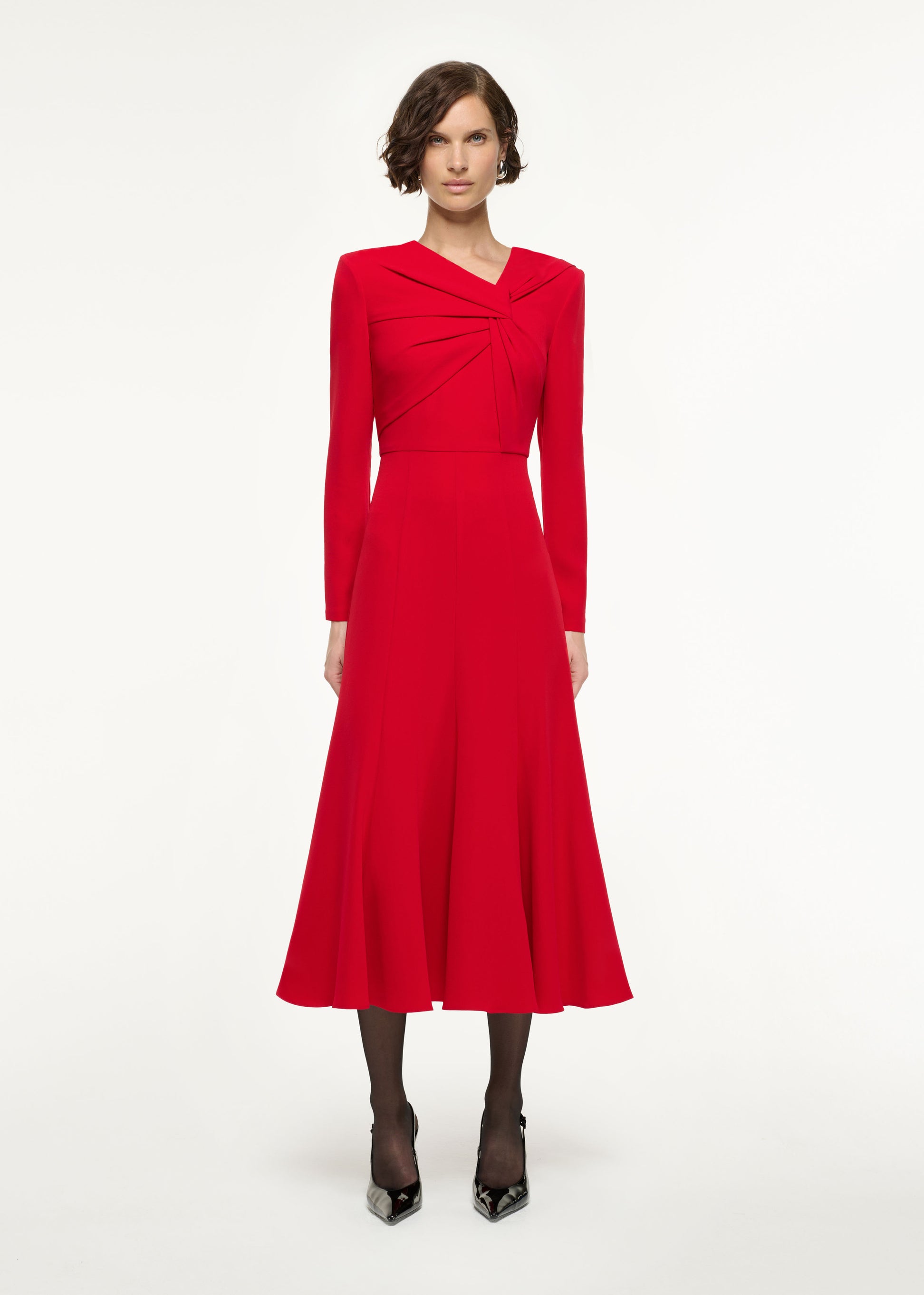 Front view of a model wearing the Long Sleeve Light Cady Midi Dress in Red