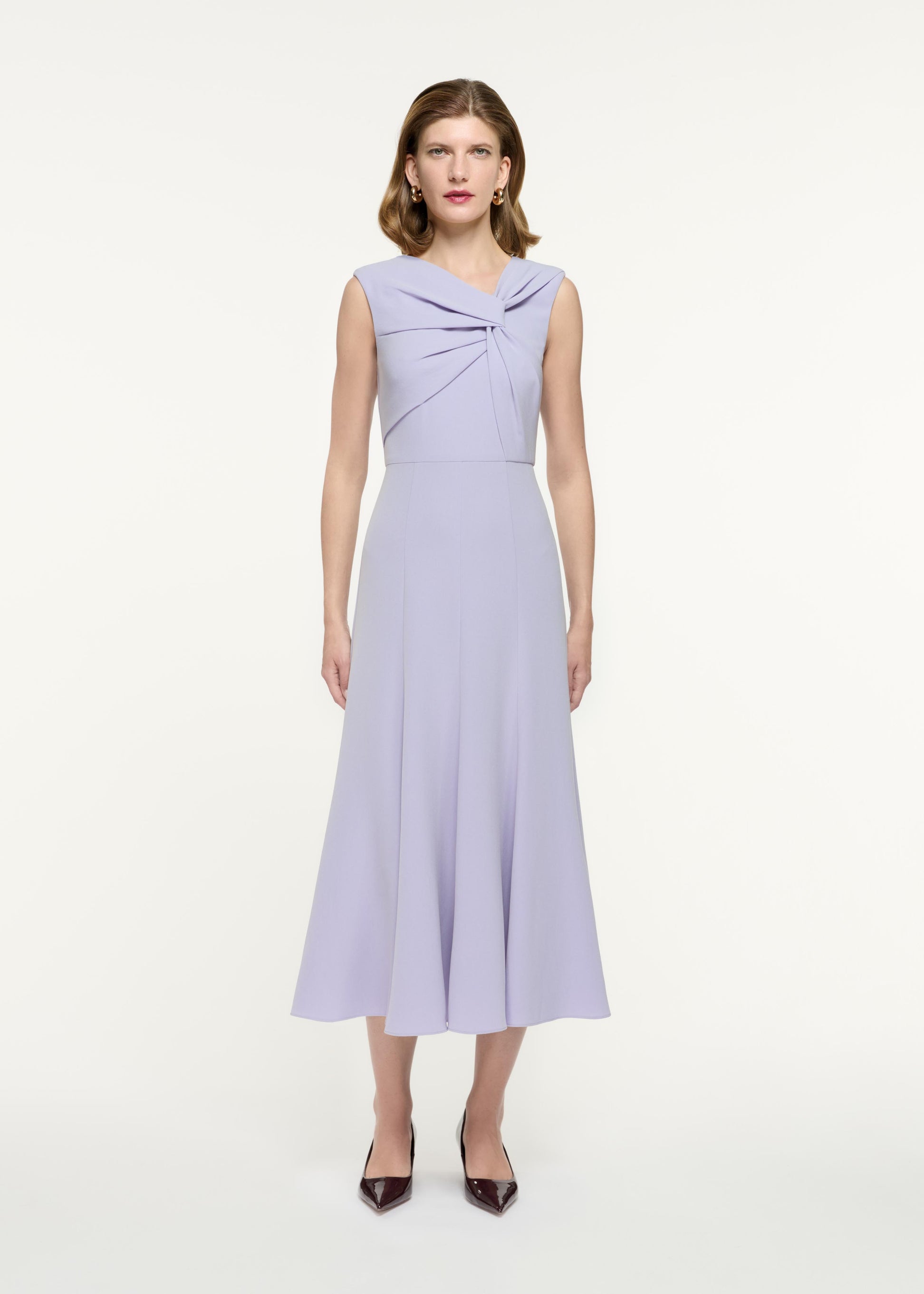 Front view of a model wearing the Sleeveless Light Cady Midi Dress in Purple