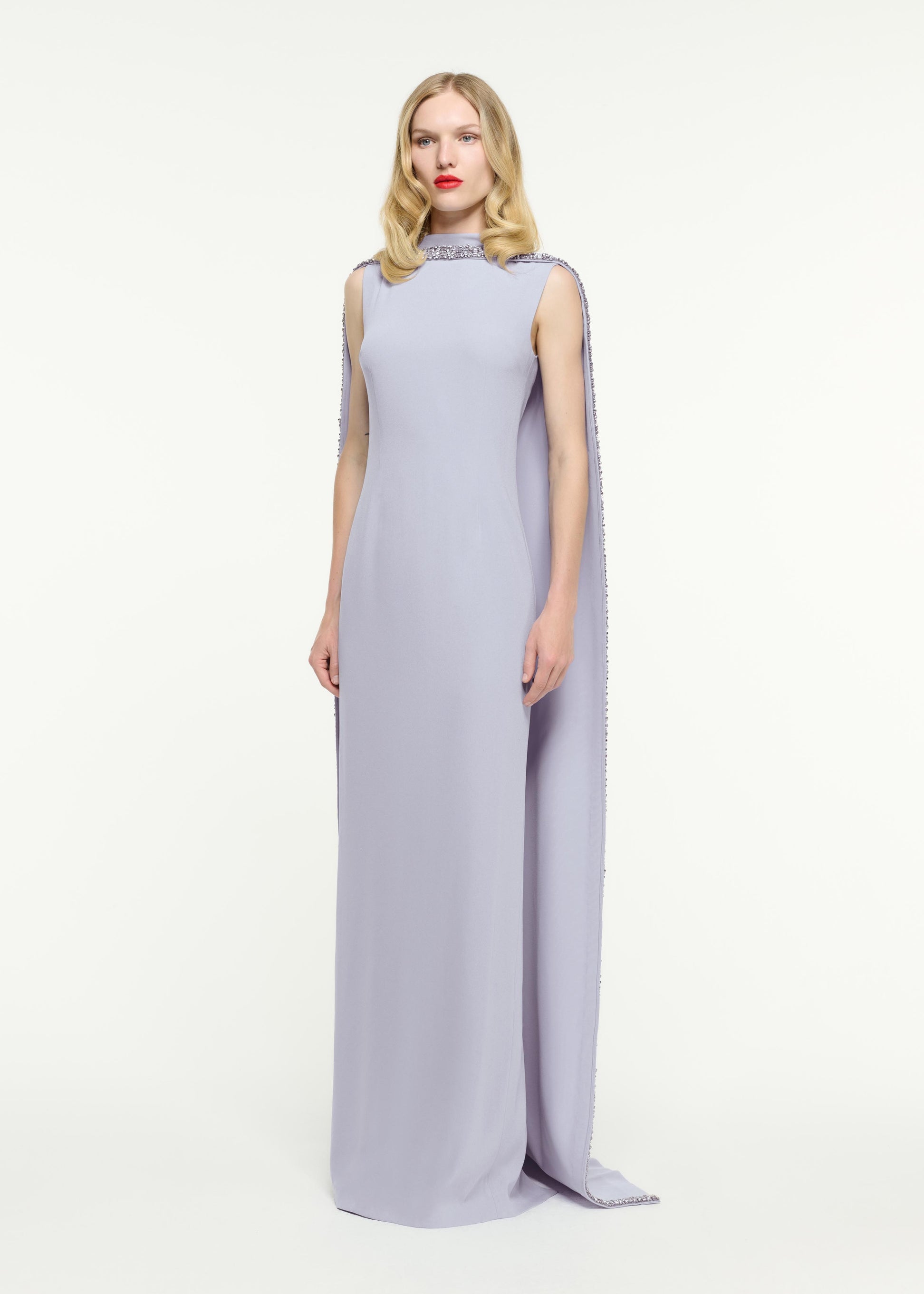 Side view of a model wearing the Embellished Cape Satin Crepe Gown in Purple