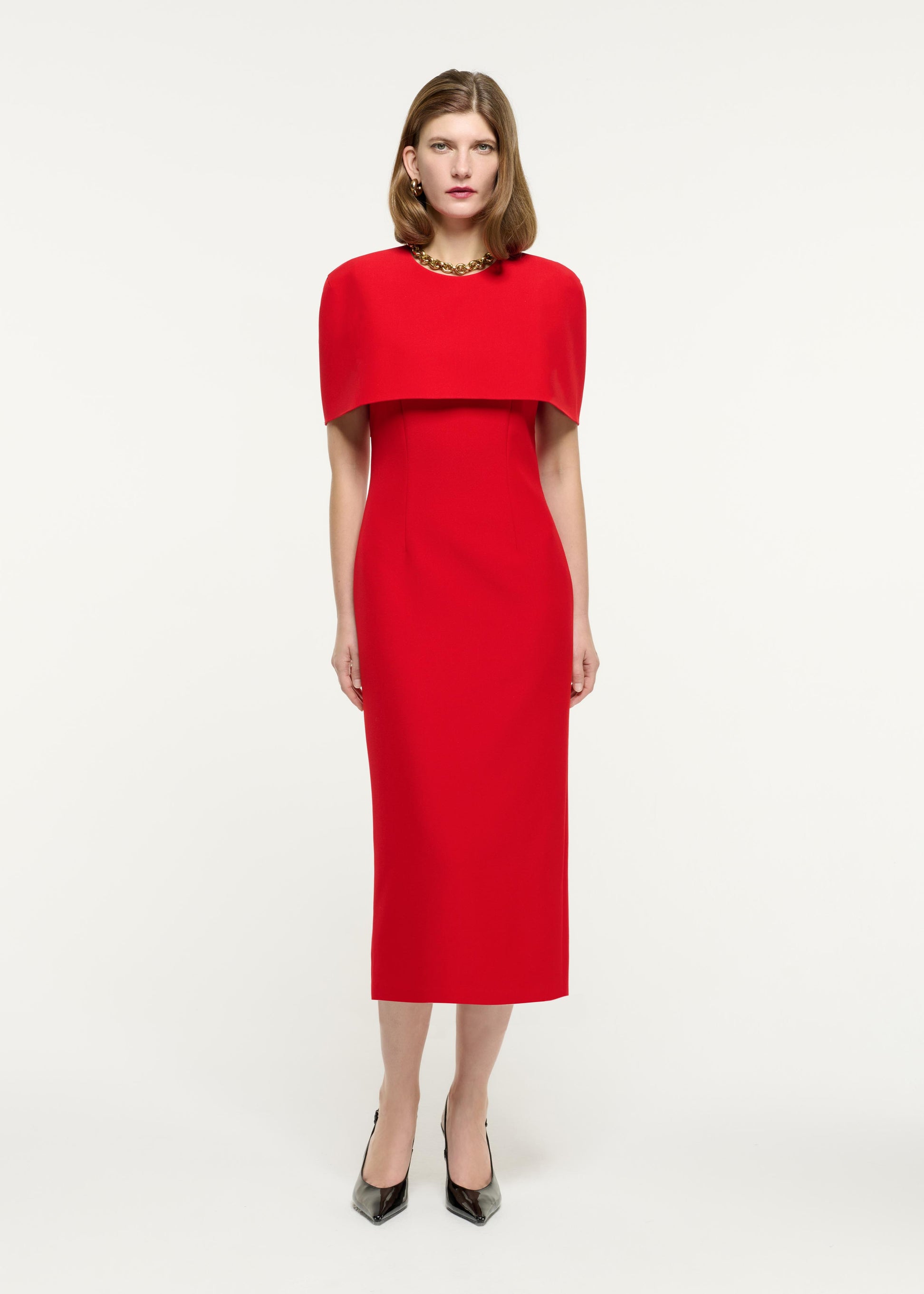 Front view of a model wearing the Cape Crepe Midi Dress in Red