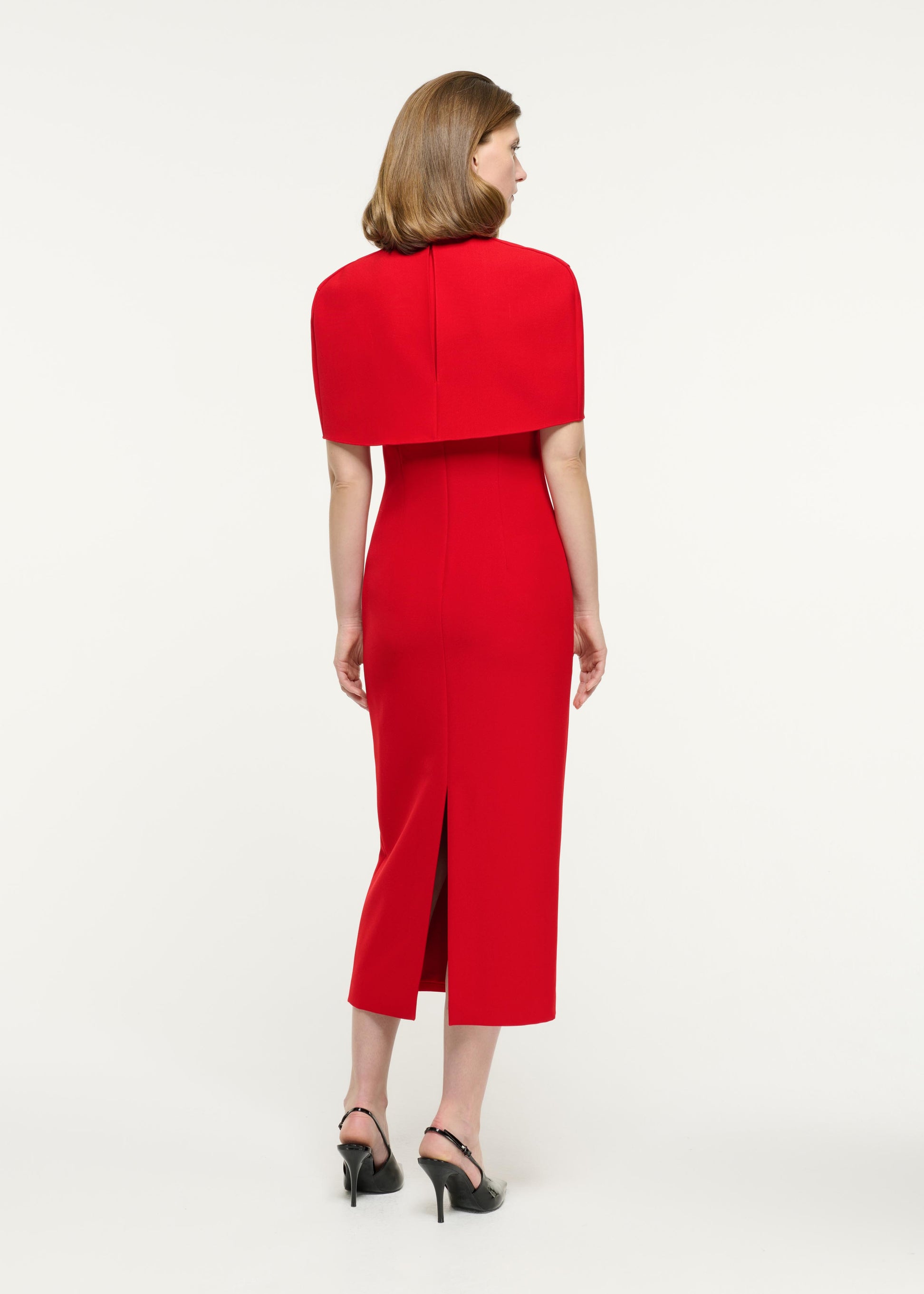 Back view of a model wearing the Cape Crepe Midi Dress in Red