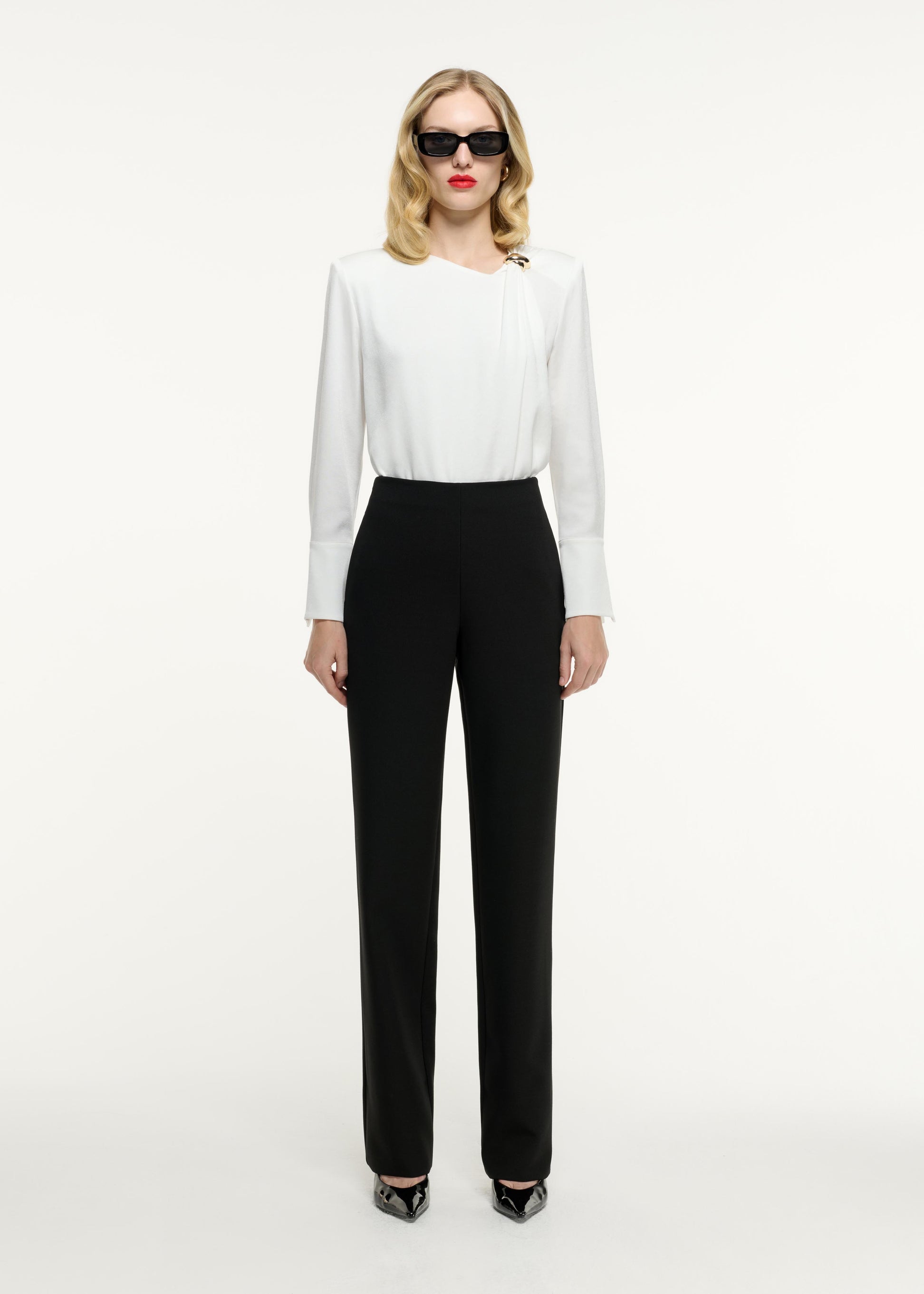 Front view of a model wearing the Straight Leg Crepe Trouser in Black