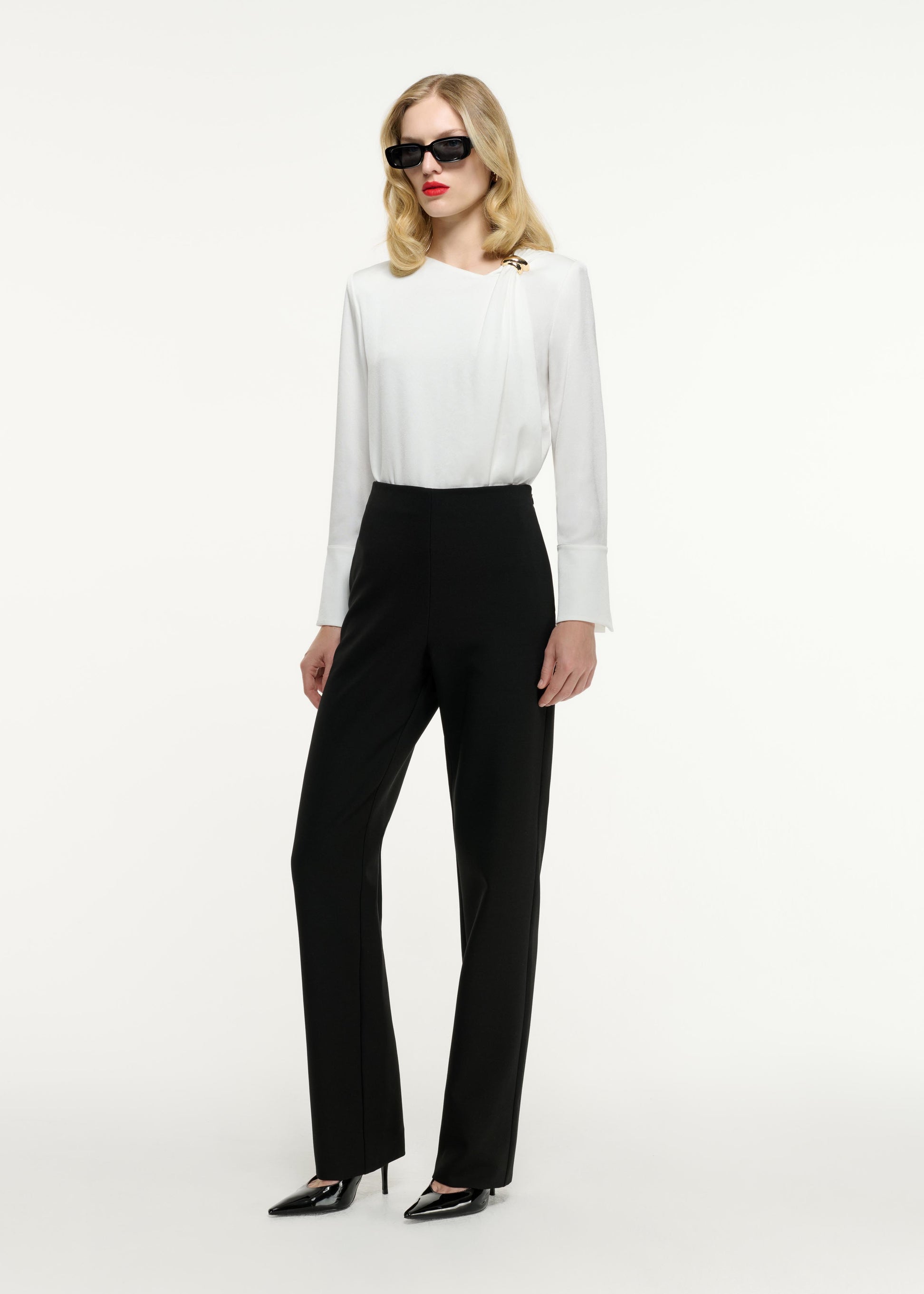 Side view of a model wearing the Straight Leg Crepe Trouser in Black