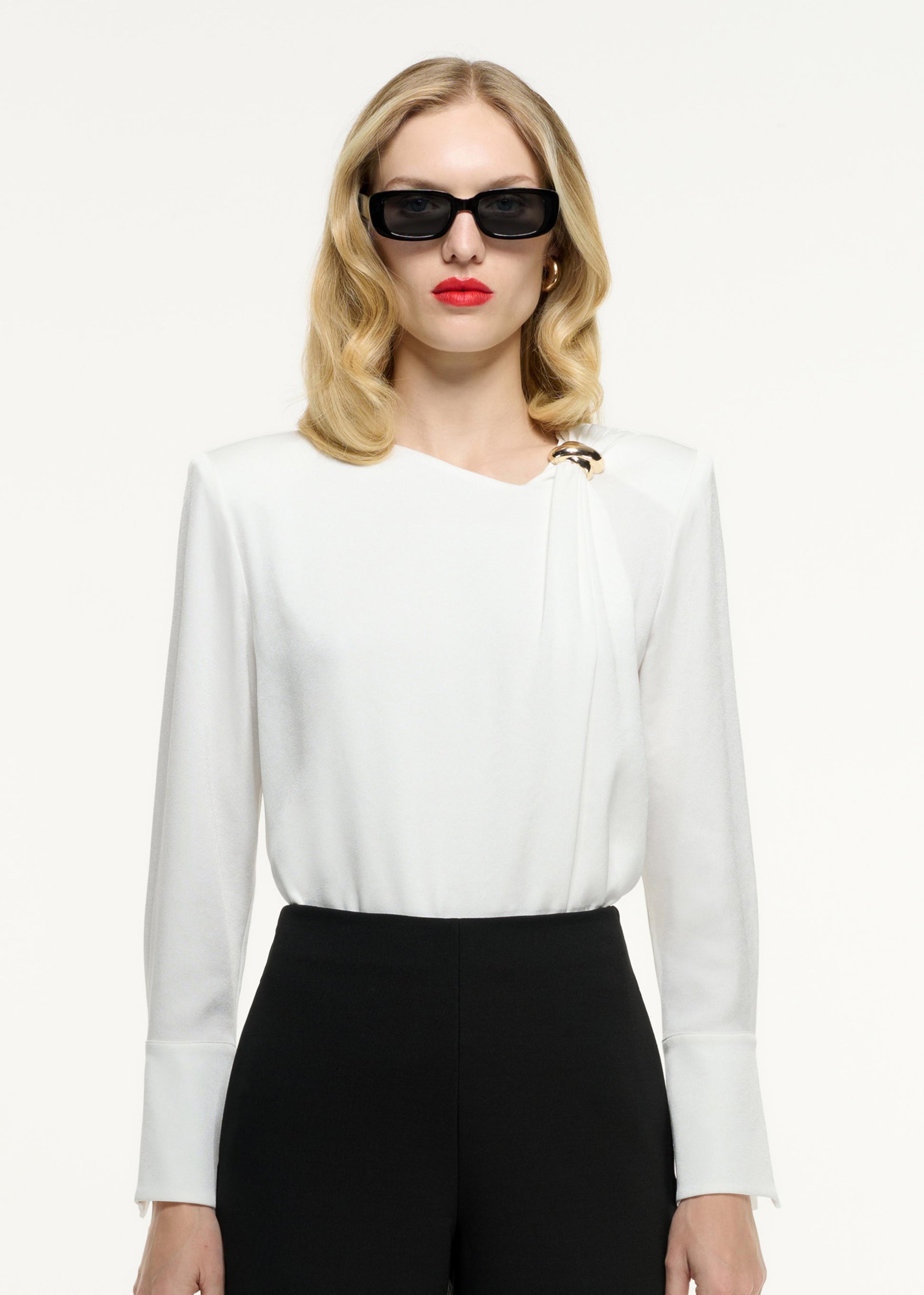 Close up of a model wearing the Long Sleeve Buckle Satin Crepe Top in White