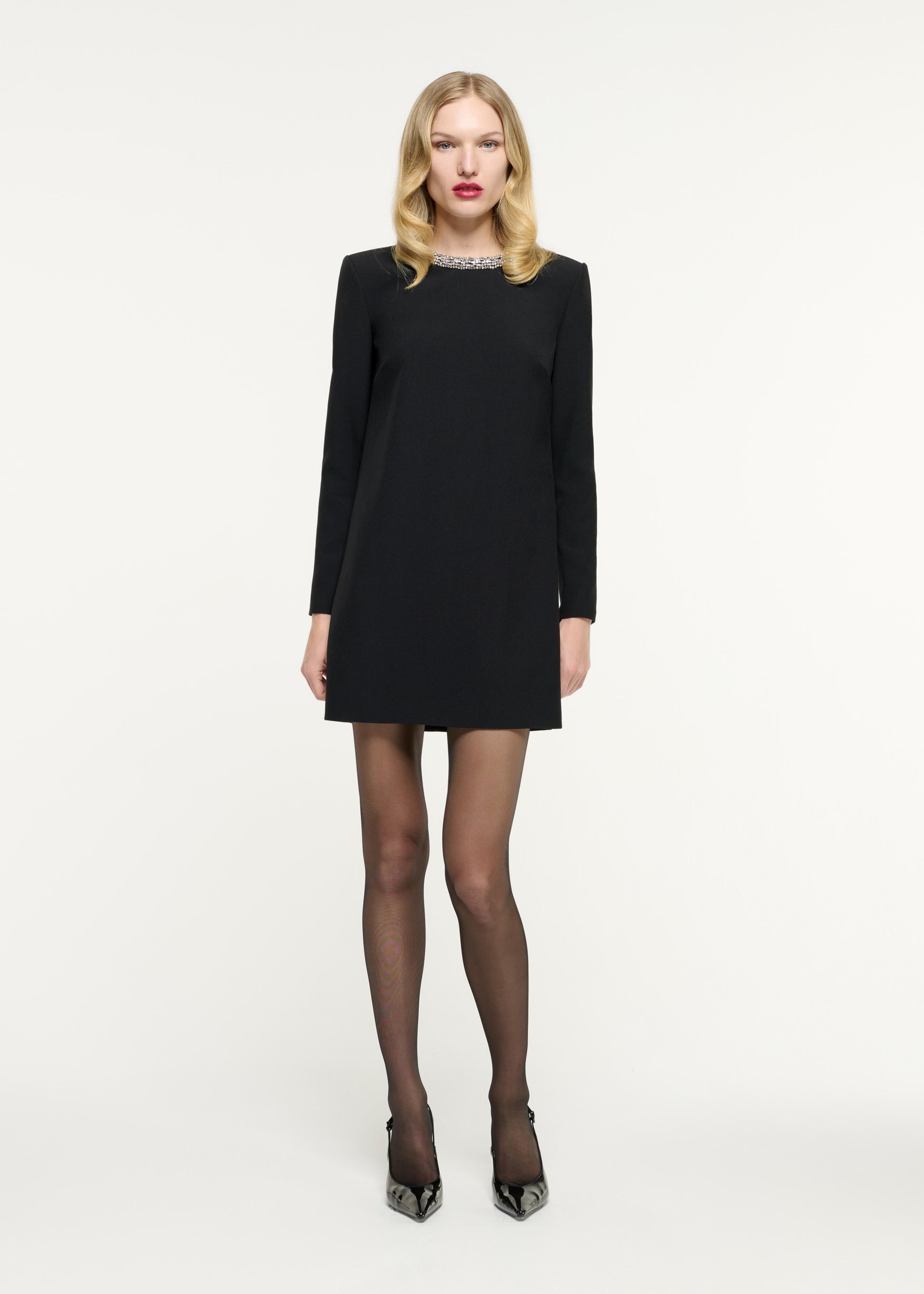 Front view of a model wearing the Long Sleeve Embellished Crepe Mini Dress in Black