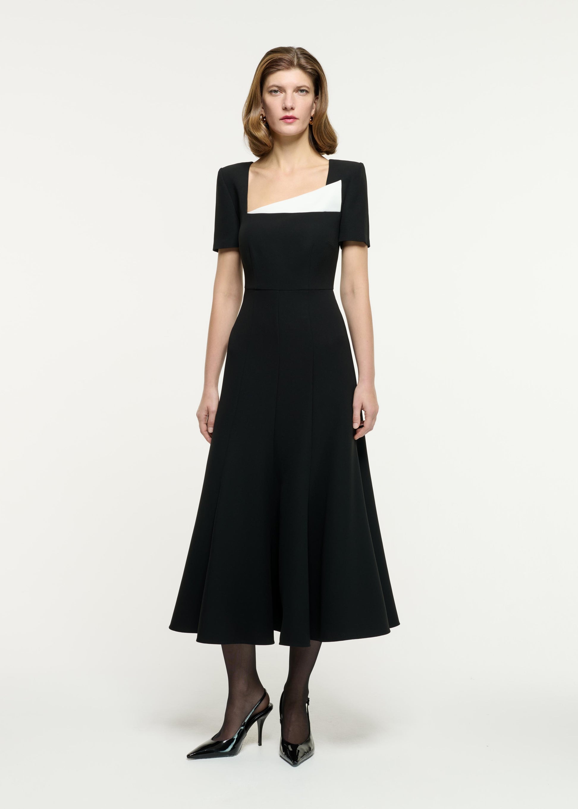 Front view of a model wearing the Contrast Fluted Midi Dress in Monochrome