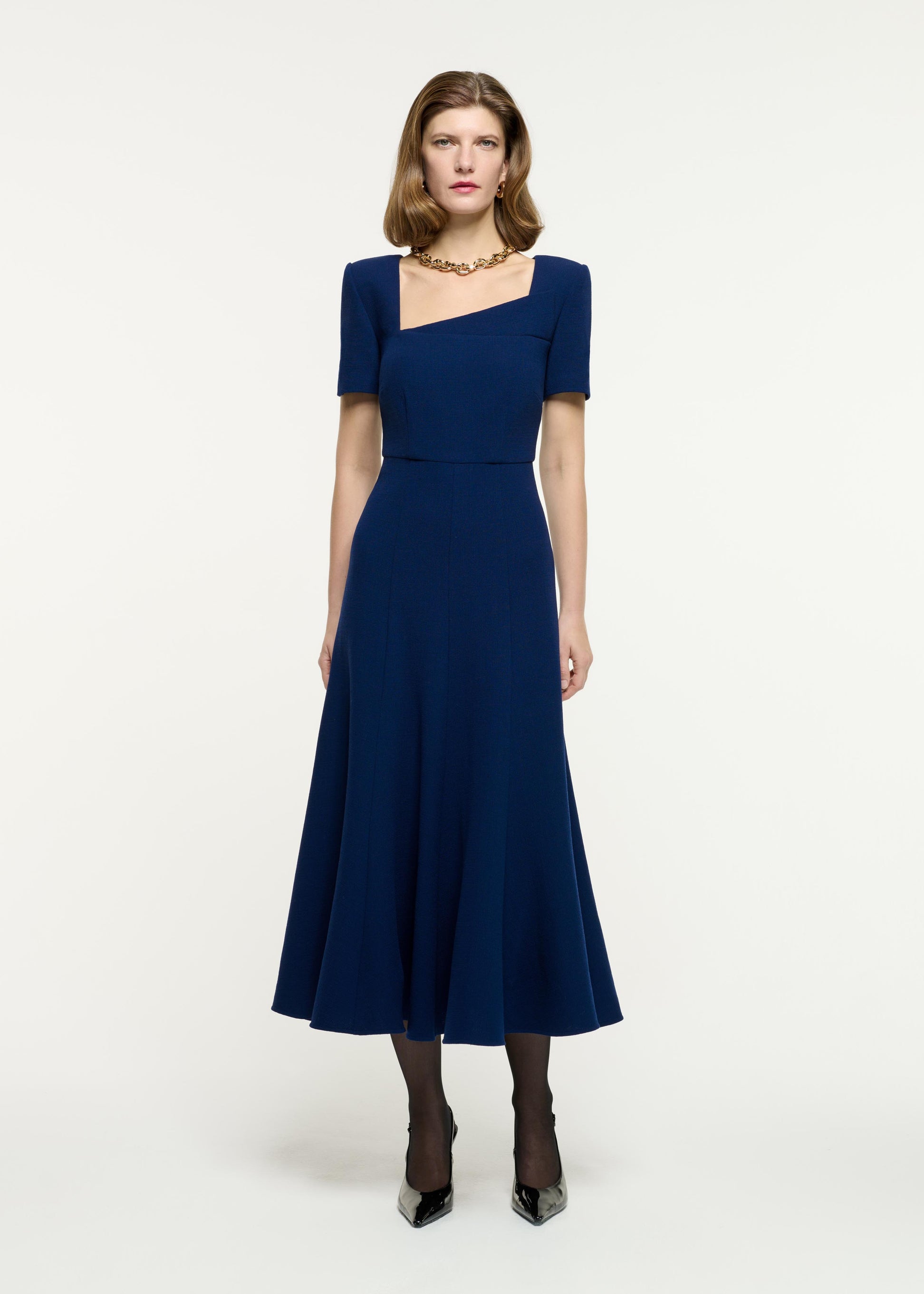 Front view of a model wearing the Short Sleeve Wool Crepe Midi Dress in Navy