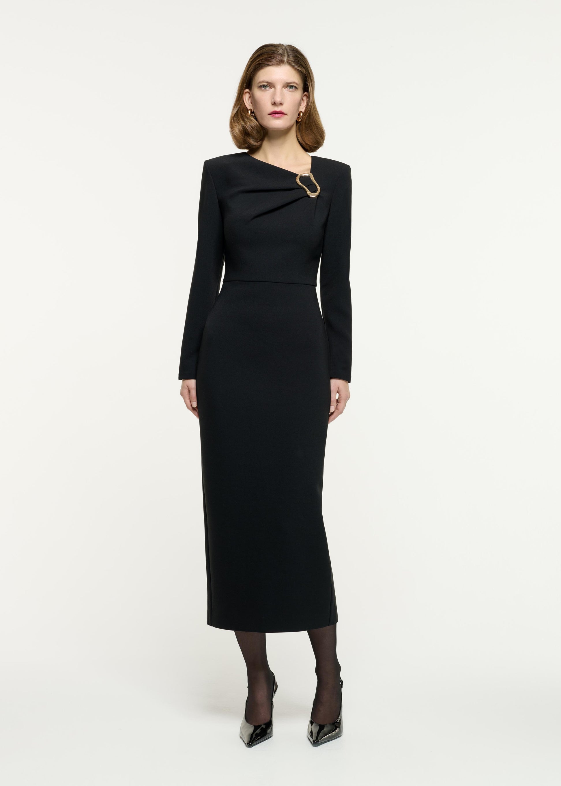 Front view of a model wearing the Long Sleeve Buckle Crepe Midi Dress in Black