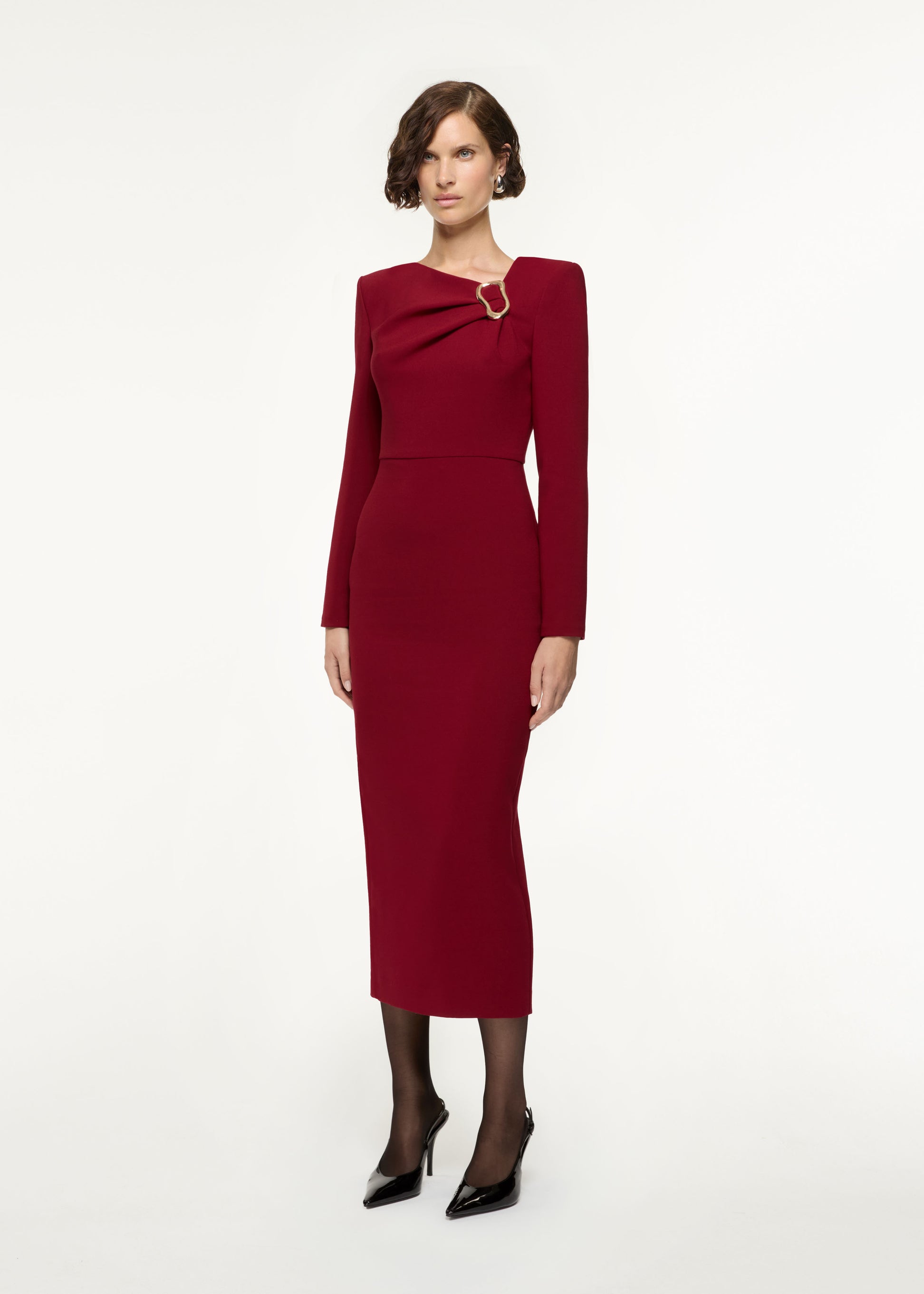 Side view of a model wearing the Long Sleeve Buckle Crepe Midi Dress in Red