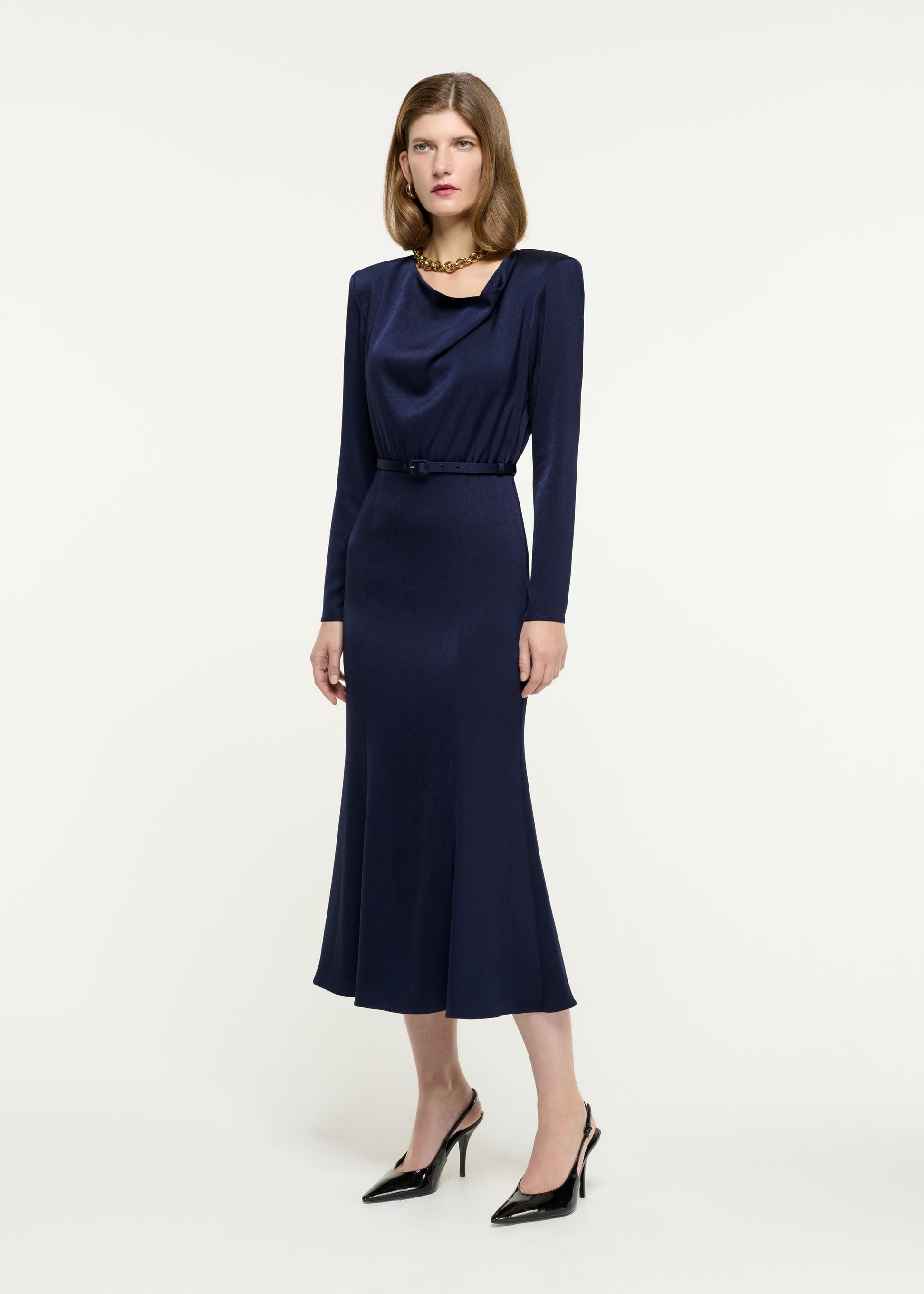 Side view of a model wearing the Cowl Drape Satin Crepe Midi Dress in Blue