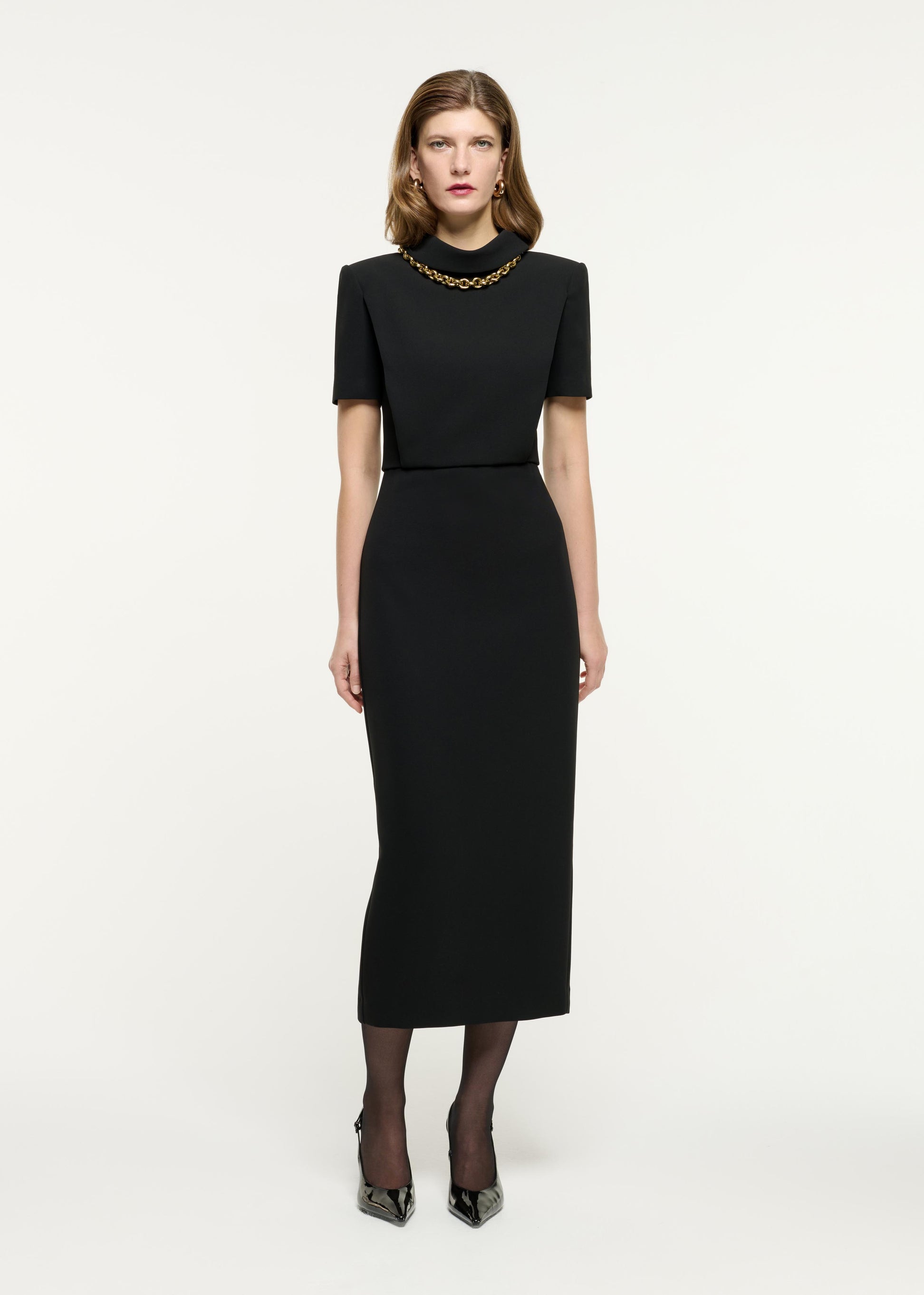 Front view of a model wearing the Collared Midi Dress in Black