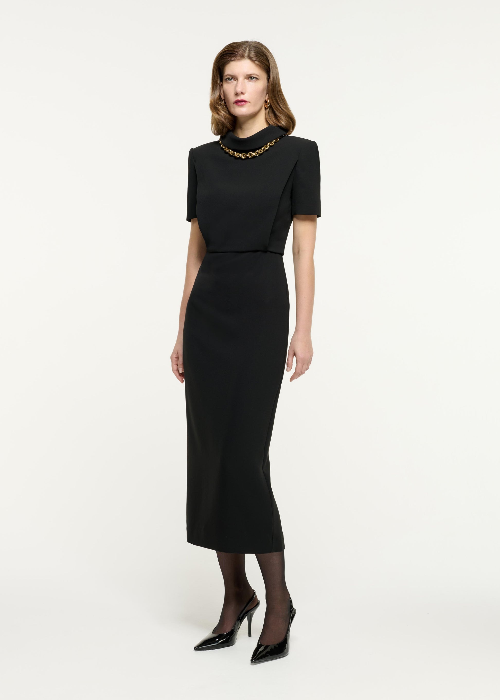 Side view of a model wearing the Collared Midi Dress in Black