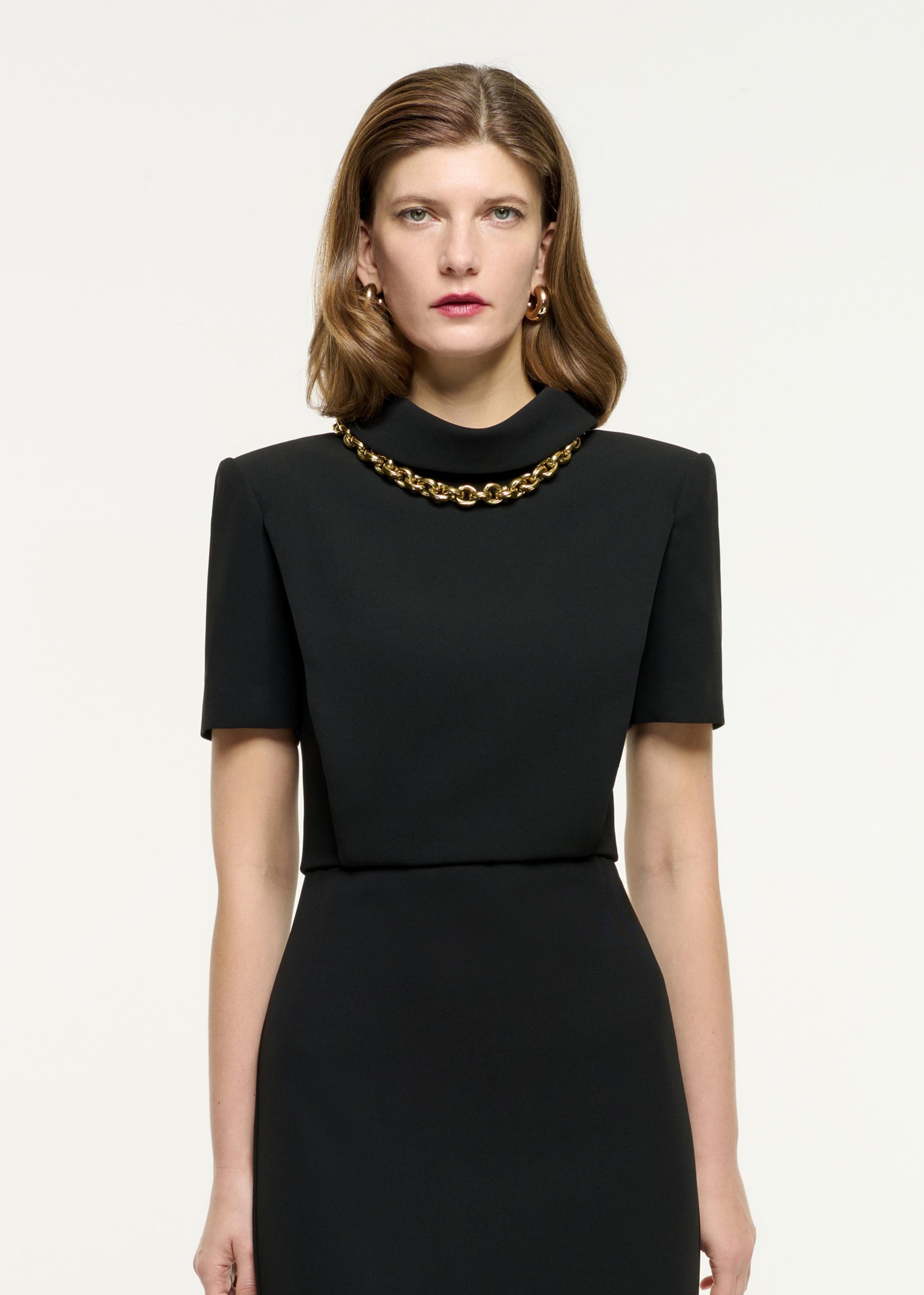 Close up of a model wearing the Collared Midi Dress in Black
