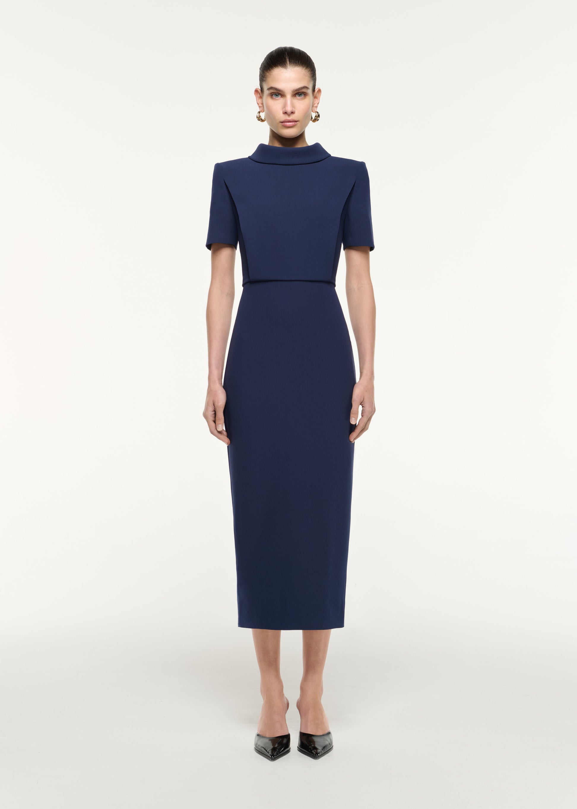 Front view of a model wearing the Collared Midi Dress in Navy