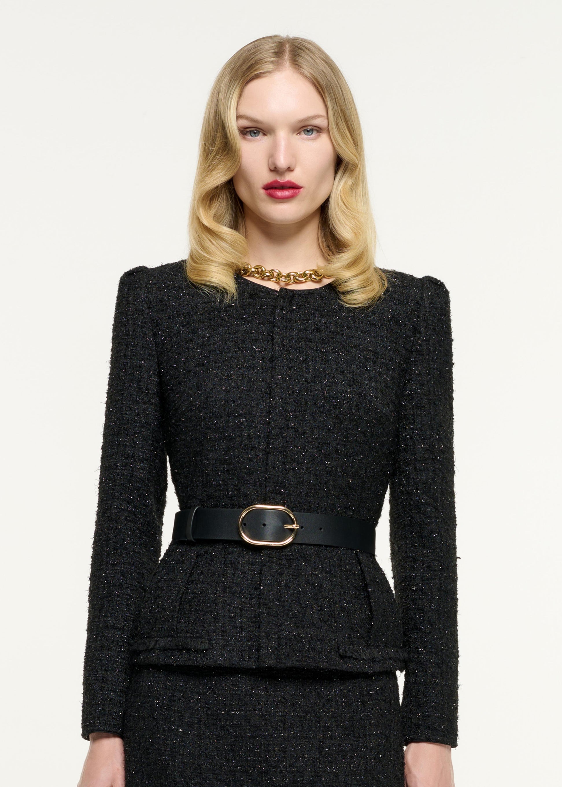 Close up of a model wearing the Boucle Midi Skirt in Black