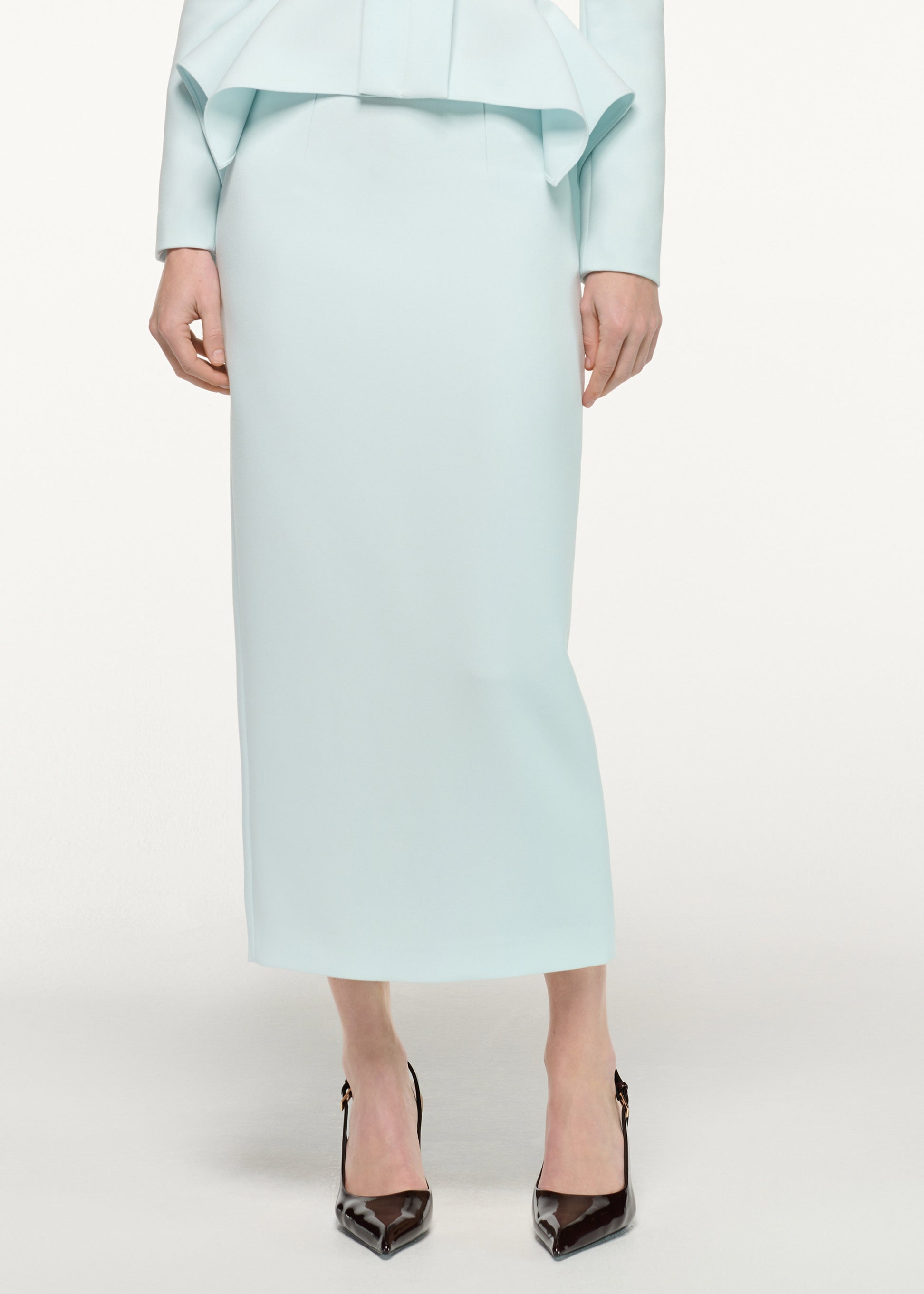 Close up of a model wearing the Crepe Midi Skirt in Aqua