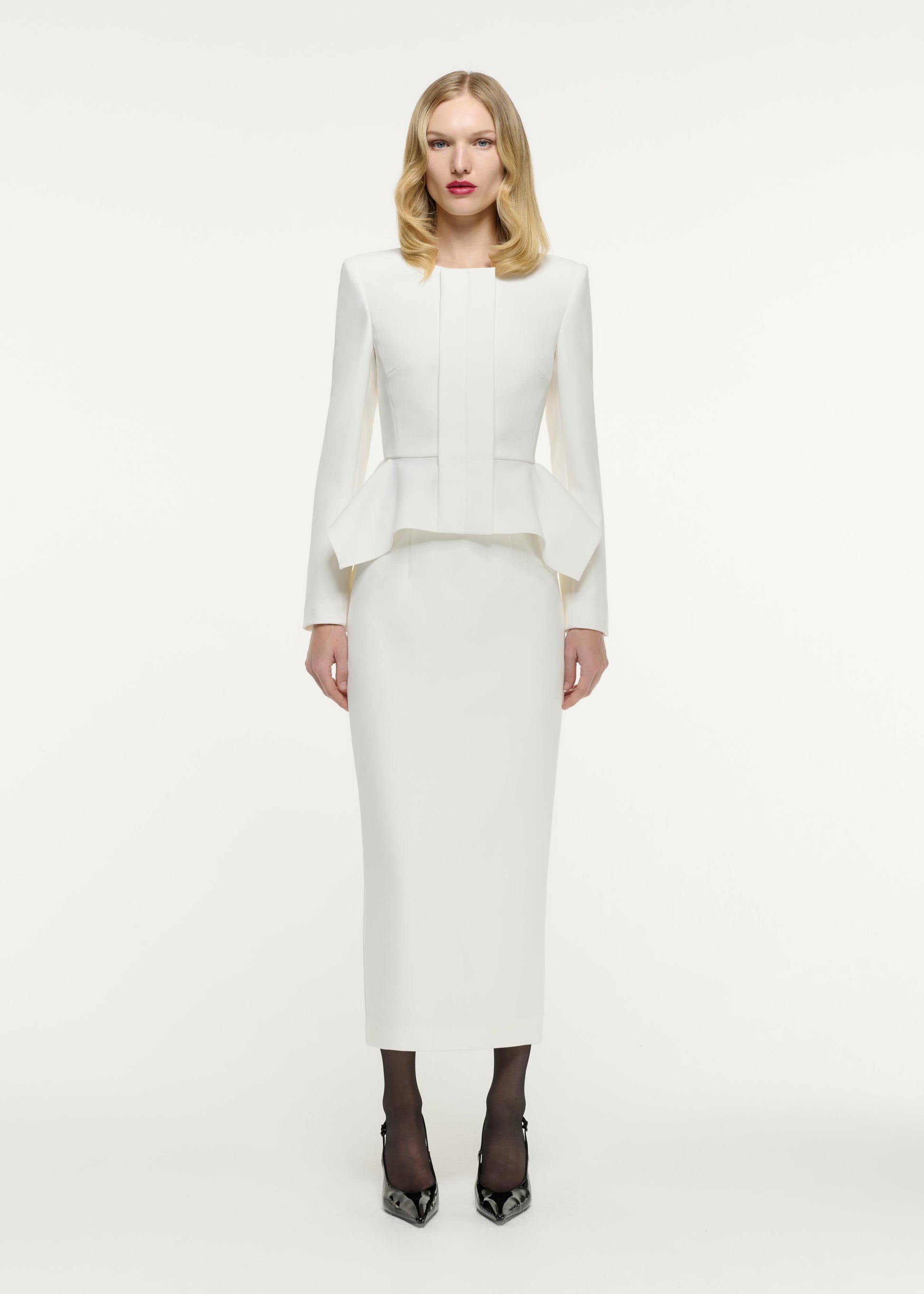 Front view of a model wearing the Crepe Midi Skirt in Cream