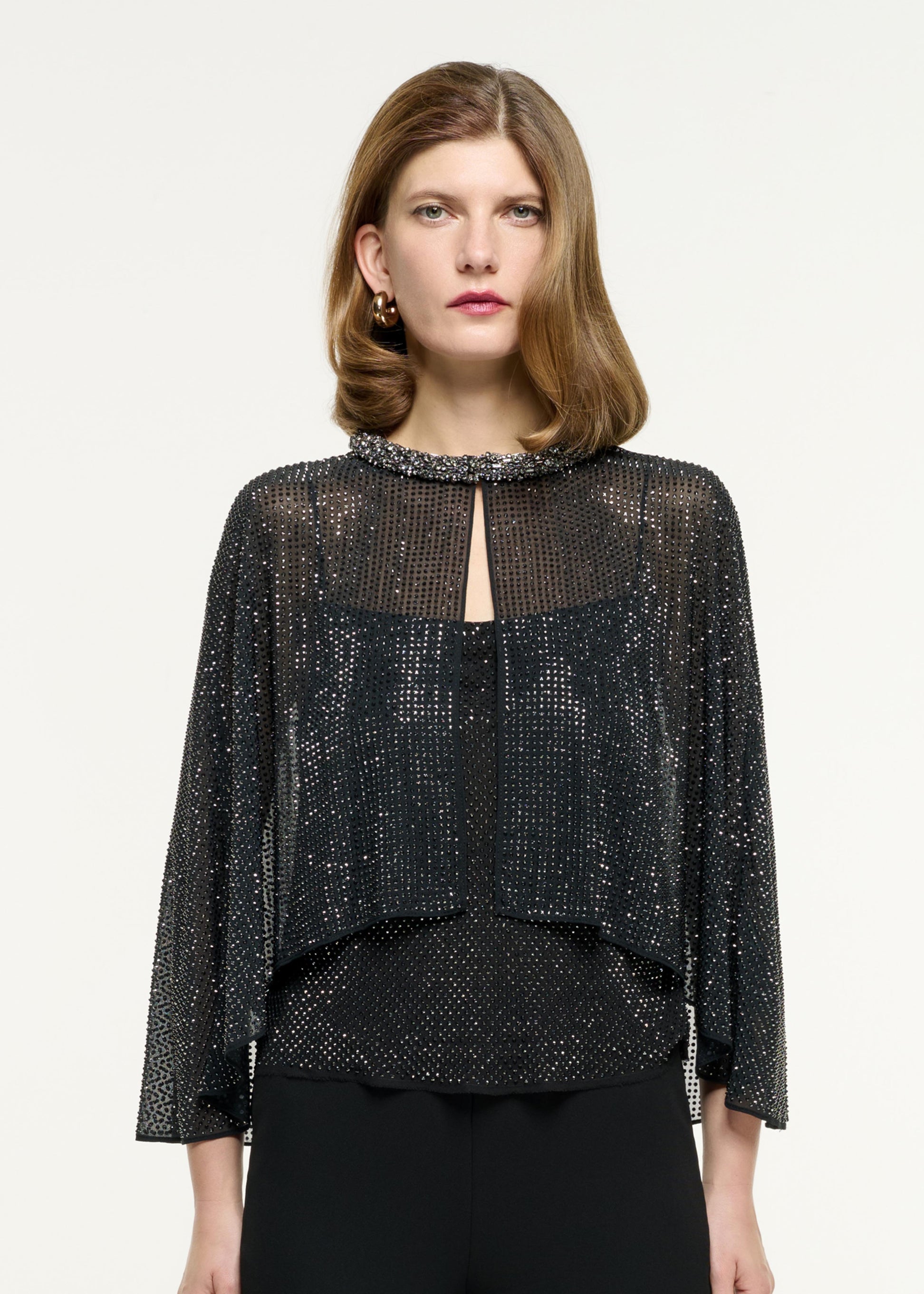 Back view of a model wearing the Diamante Chiffon Cape in Black