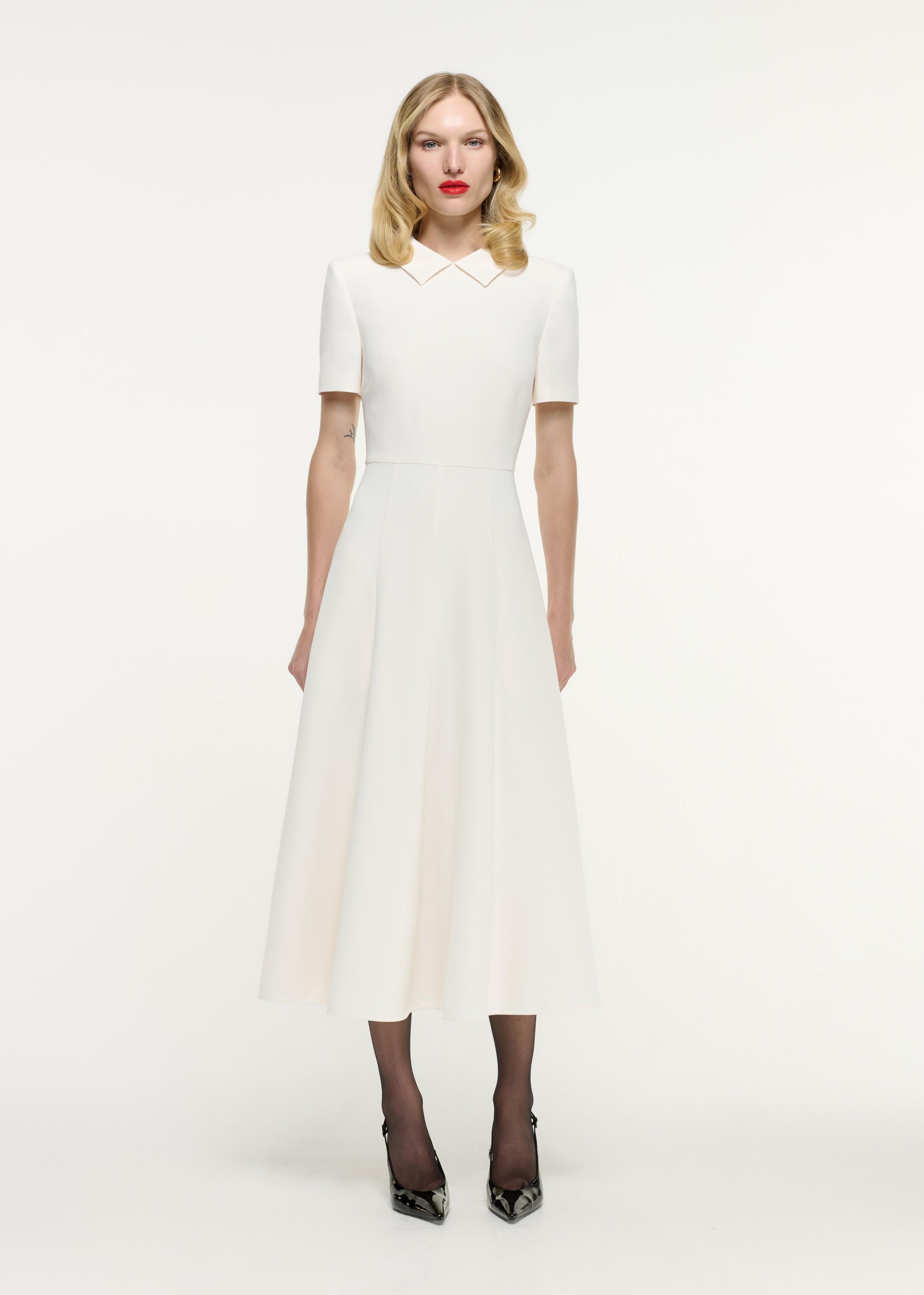 Front view of a model wearing the Short Sleeve Collar Heavy Cady Midi Dress in White