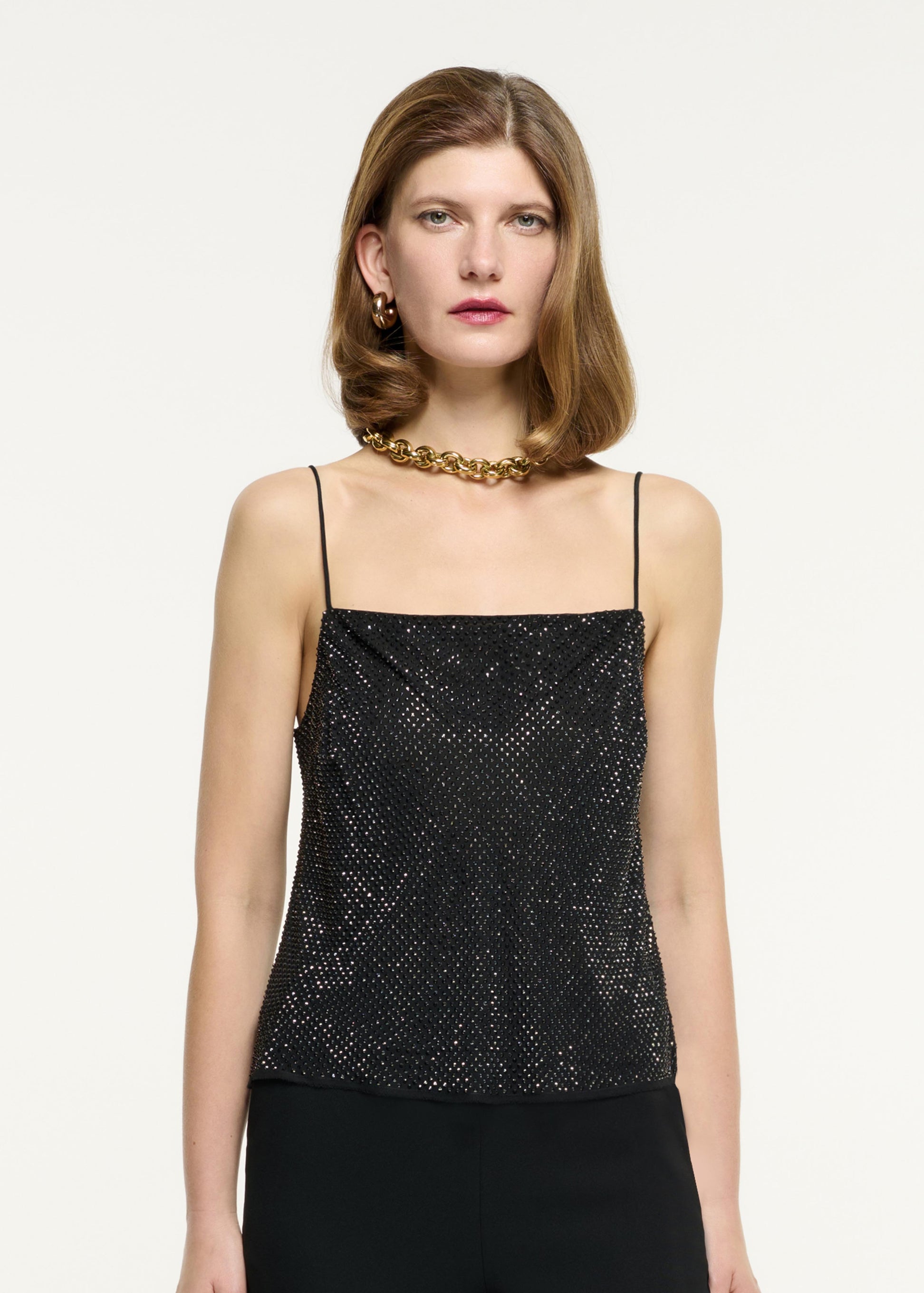 Close up of a model wearing the Diamante Chiffon Top in Black