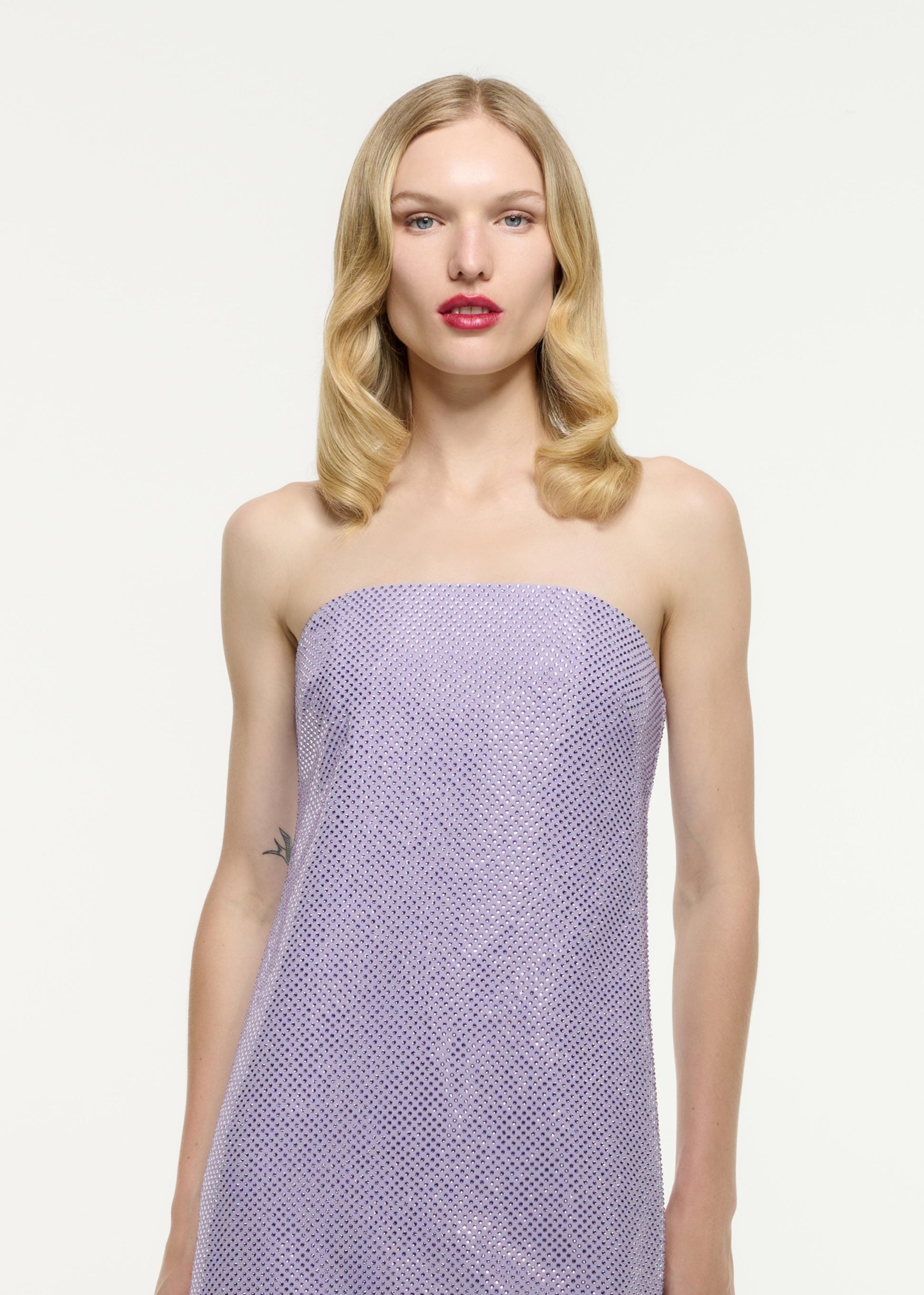 Close up of a model wearing the Strapless Diamante Mini Dress in Purple
